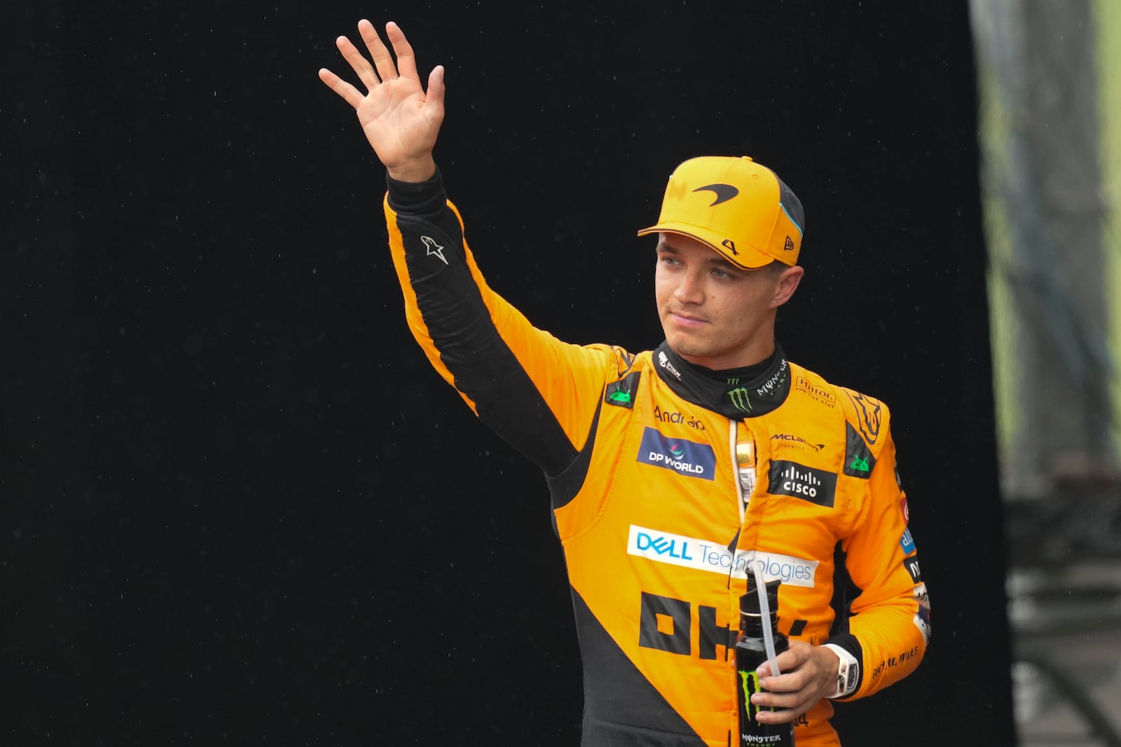 Pole position winner, McLaren driver Lando Norris of Britain, celebrates after the qualifying session ahead of the Brazilian Formula One Grand Prix at the Interlagos race track, in Sao Paulo, Brazil, Sunday, Nov. 3, 2024. (AP Photo/Andre Penner)