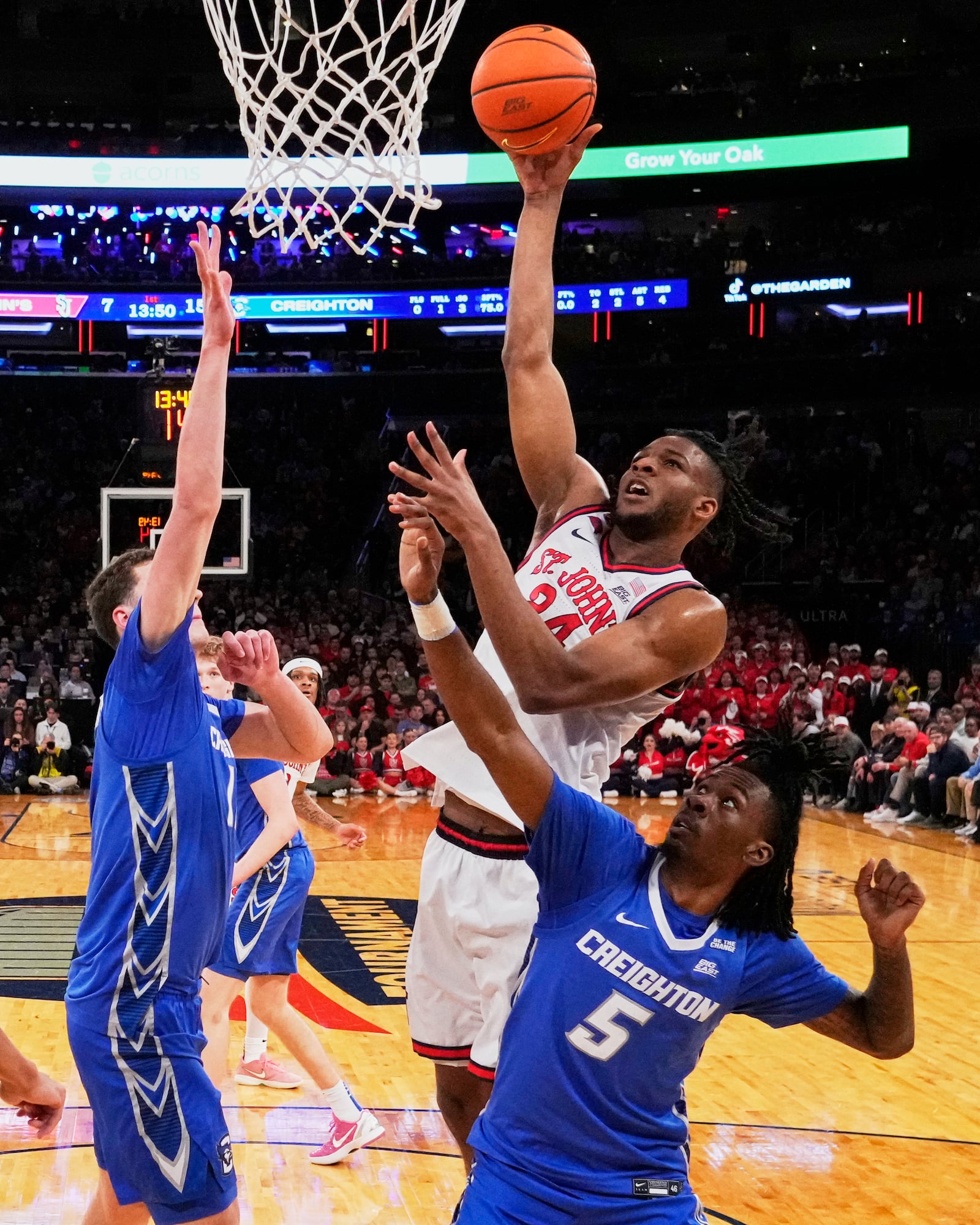 St. John's's Zuby Ejiofor (24) shoots over Creighton's Jamiya Neal (5) during the first half of an NCAA college basketball game in the championship of the Big East Conference tournament Saturday, March 15, 2025, in New York. (AP Photo/Frank Franklin II)