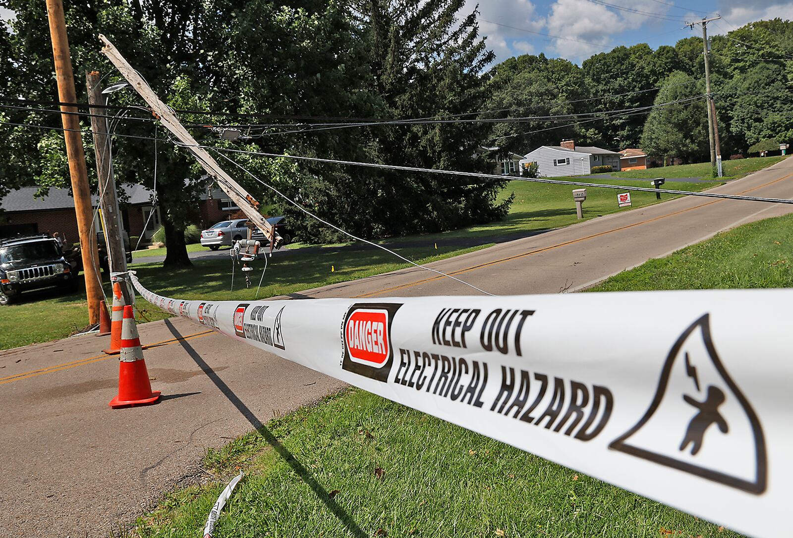 Leffel Lane is still closed Monday, July 31, 2023 due to a broken utility pole that fell during Saturday's early morning storm. The road is closed from East Possum Road to Cheviot Hills Drive. BILL LACKEY/STAFF