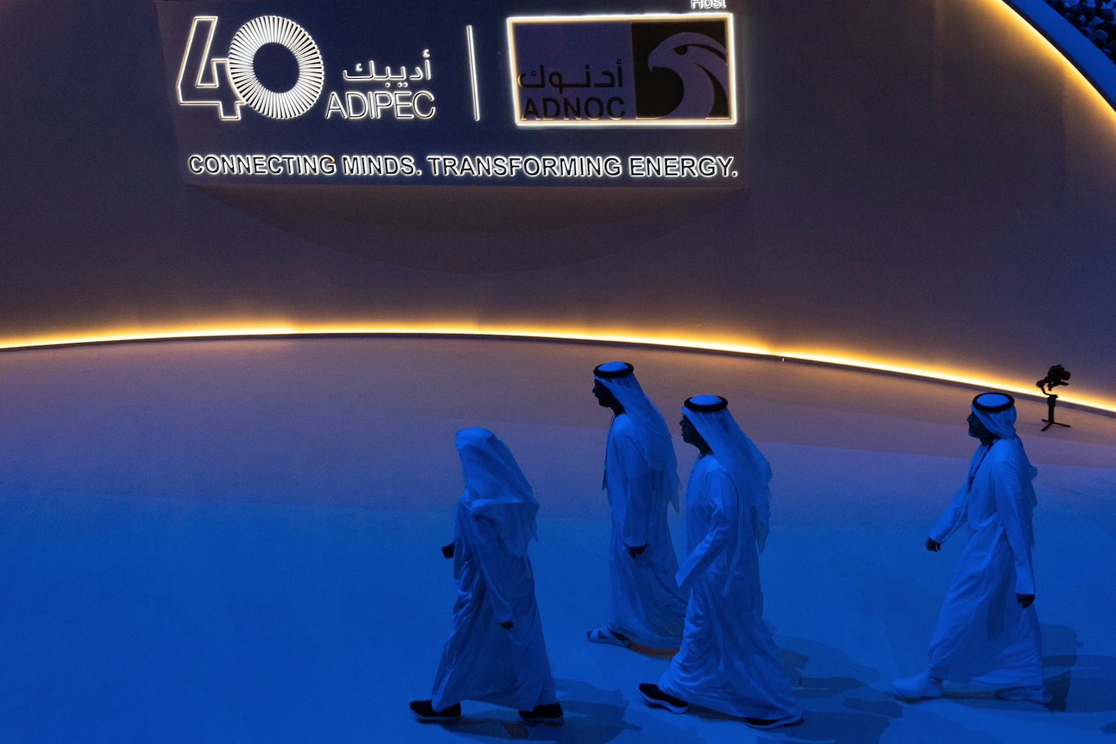 Delegates leave the hall after the inaugural session of annual Abu Dhabi International Petroleum Exhibition and Conference (ADIPEC) in Abu Dhabi, United Arab Emirates, Monday, Nov. 4, 2024. (AP Photo/Altaf Qadri)