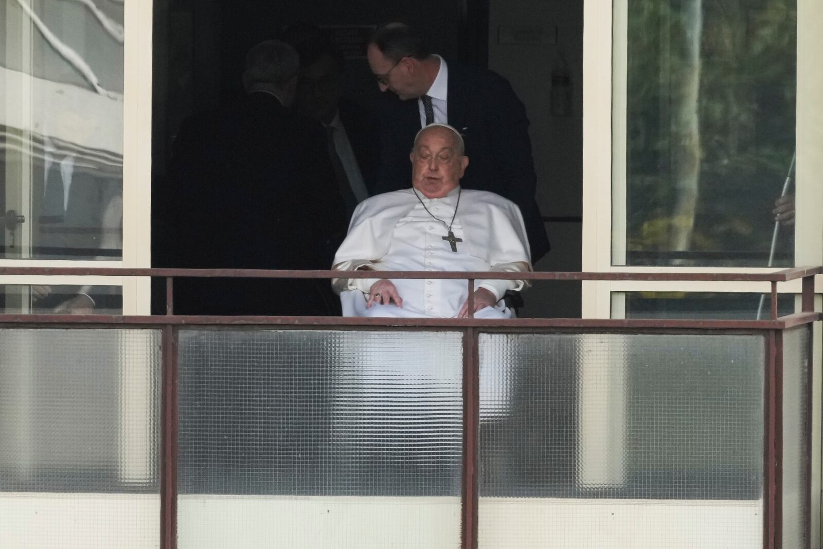 Pope Francis leaves after appearing at a window of the Agostino Gemelli Polyclinic in Rome, Sunday, March 23, 2025, where he has been treated for bronchitis and bilateral pneumonia since Feb. 14. (AP Photo/Andrew Medichini)