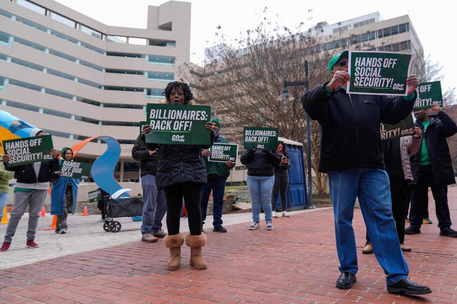 Demonstrators gather outside of the Edward A. Garmatz United States District Courthouse in Baltimore, on Friday, March 14, 2025, before a hearing regarding the Department of Government Efficiency's access to Social Security data. (AP Photo/Stephanie Scarbrough)