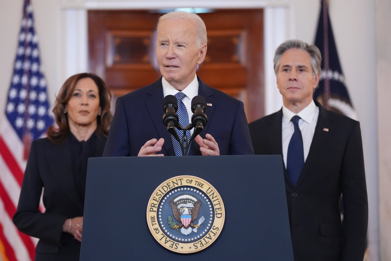 President Joe Biden, center, with Vice President Kamala Harris, left, and Sec. of State Anthony Blinken, right, speaks in the Cross Hall of the White House on the announcement of a ceasefire deal in Gaza and the release of dozens of hostages after more than 15 months of war, Wednesday, Jan. 15, 2025, in Washington. (AP Photo/Evan Vucci)