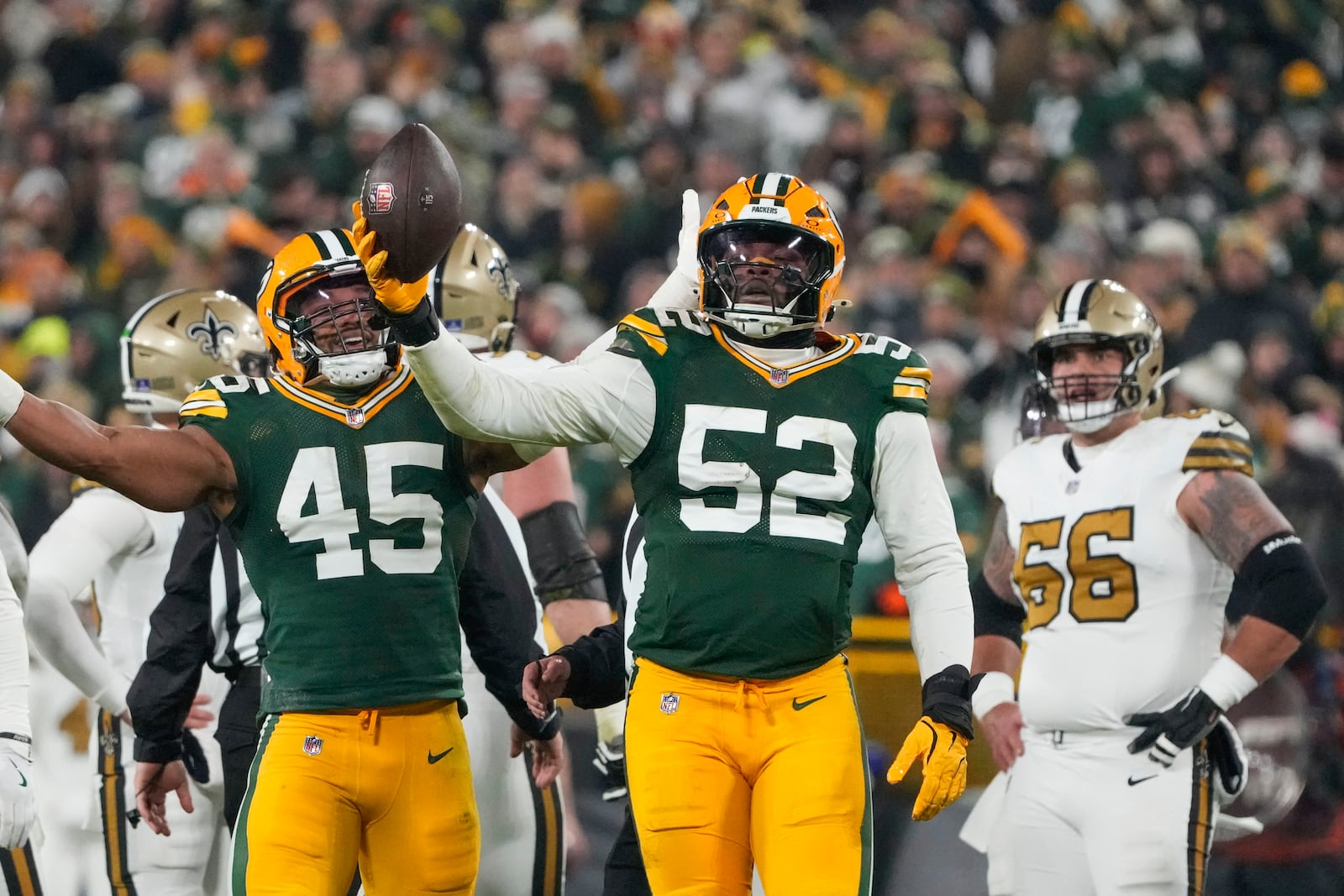 Green Bay Packers defensive end Rashan Gary (52) celebrates a fumble recovery during the first half of an NFL football game against the New Orleans Saints, Monday, Dec. 23, 2024, in Green Bay, Wis.(AP Photo/Morry Gash)