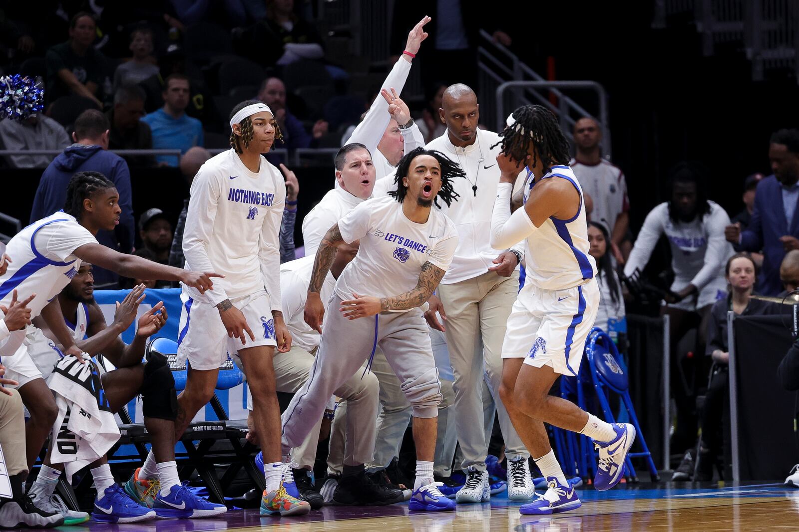 Memphis guard Colby Rogers celebrates with the bench after a three-point basket during the second half against Colorado State in the first round of the NCAA college basketball tournament, Friday, March 21, 2025, in Seattle. (AP Photo/Ryan Sun)