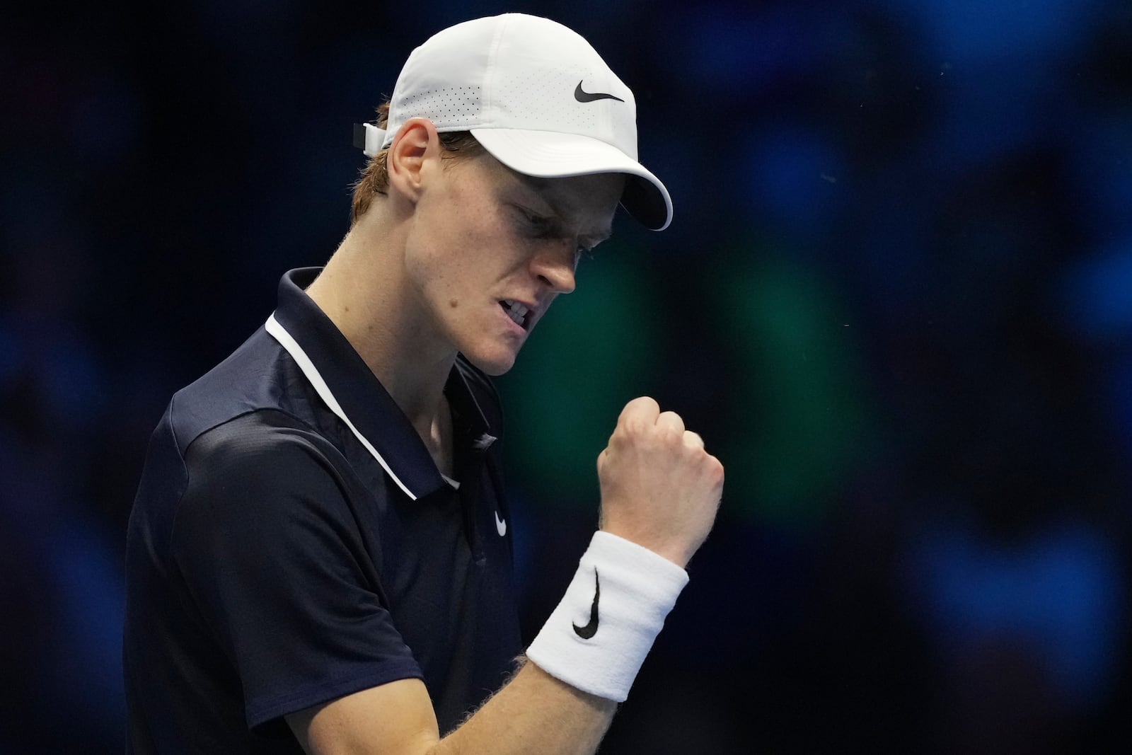 Italy's Jannik Sinner reacts during the singles tennis match of the ATP World Tour Finals against United States' Taylor Fritz, at the Inalpi Arena, in Turin, Italy, Tuesday, Nov. 12, 2024. (AP Photo/Antonio Calanni)