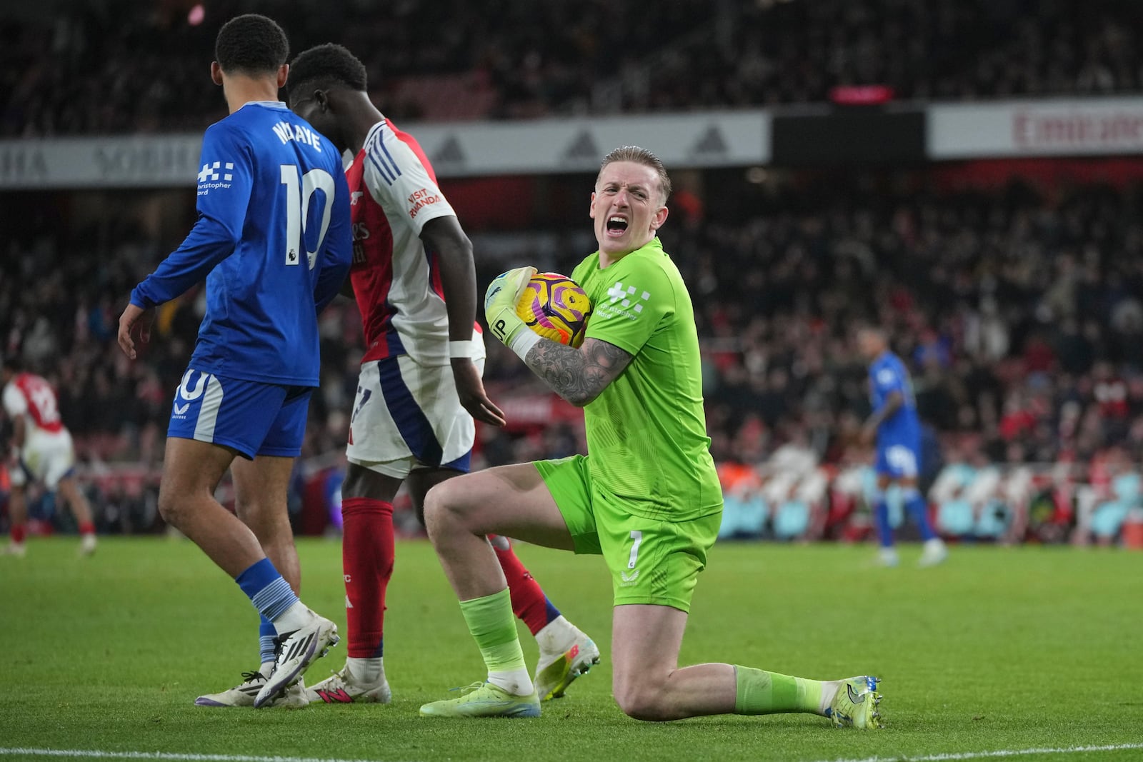 Everton's goalkeeper Jordan Pickford in action during the English Premier League soccer match between Arsenal and Everton at Emirates Stadium in London, Saturday, Dec. 14, 2024. (AP Photo/Kin Cheung)