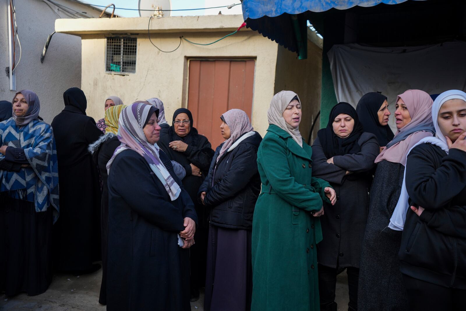 Mourners attend the funeral of Palestinians who were killed in the Israeli bombardment of the Gaza Strip at Al-Aqsa Hospital in Deir al-Balah, Wednesday, Jan. 15, 2025. (AP Photo/Abdel Kareem Hana)