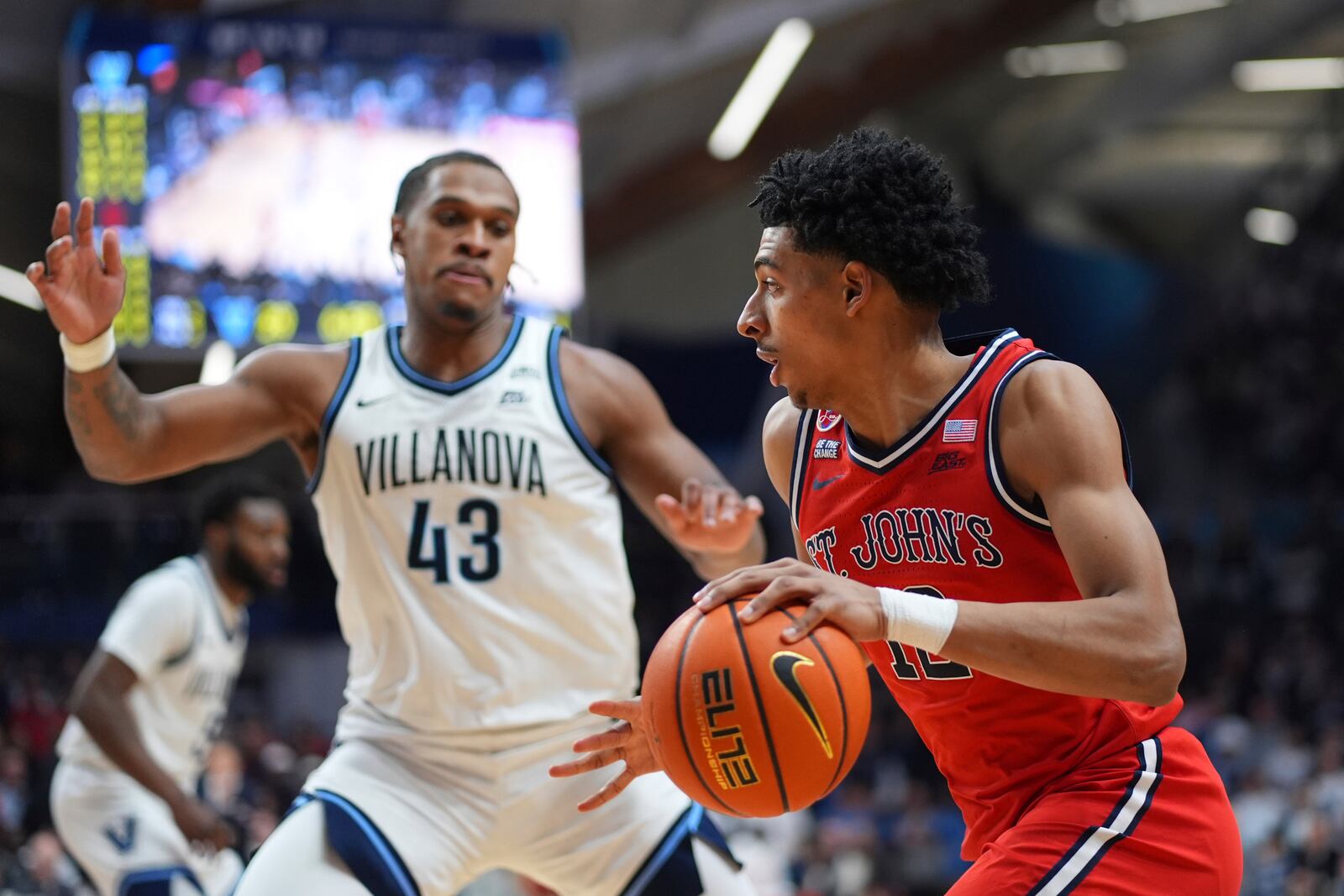 St. John's RJ Luis Jr., right, tries to get past Villanova's Eric Dixon during the first half of an NCAA college basketball game, Wednesday, Feb. 12, 2025, in Villanova, Pa. (AP Photo/Matt Slocum)