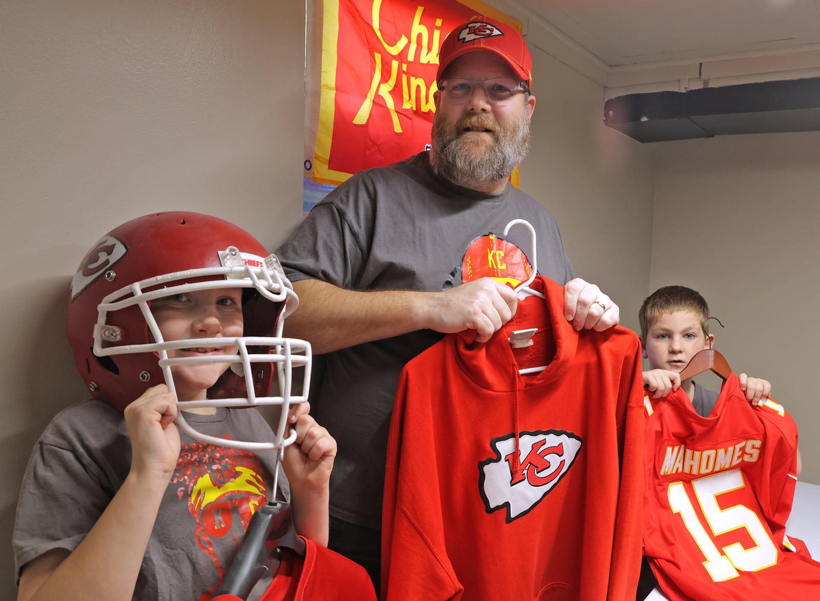 Darrick Riggs and his sons, Patrick, left, and Drew, are die hard Kansas City Chiefs fans and are hoping for a Super Bowl three-peat. BILL LACKEY/STAFF