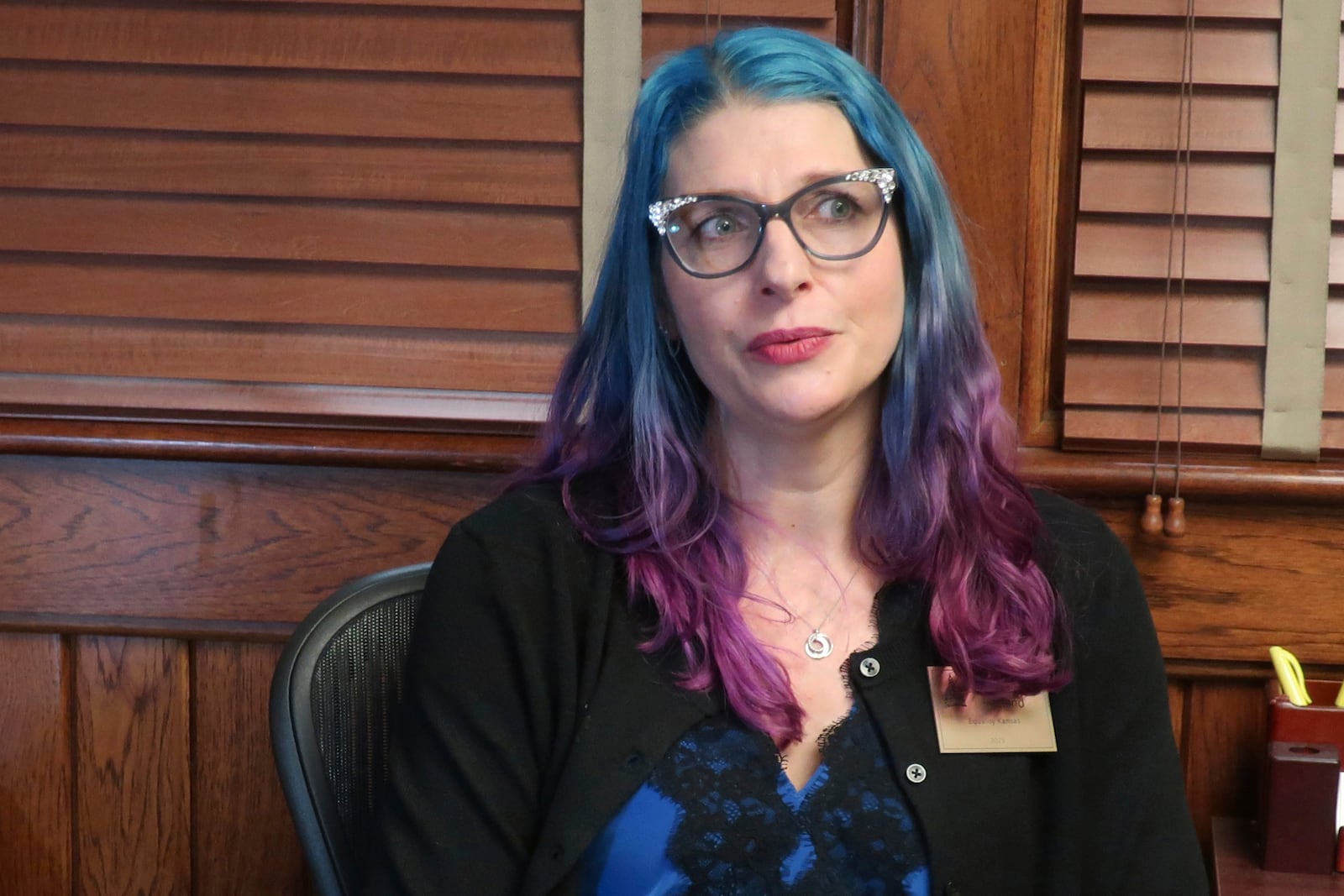 Elise Flatland, an Olathe, Kan., mother of two transgender children, talks during an interview with The Associated Press about her efforts to get a passport for her 12-year-old transgender son listing his gender as male, Wednesday, Jan. 29, 2025, at the Statehouse in Topeka, Kan. (AP Photo/John Hanna)