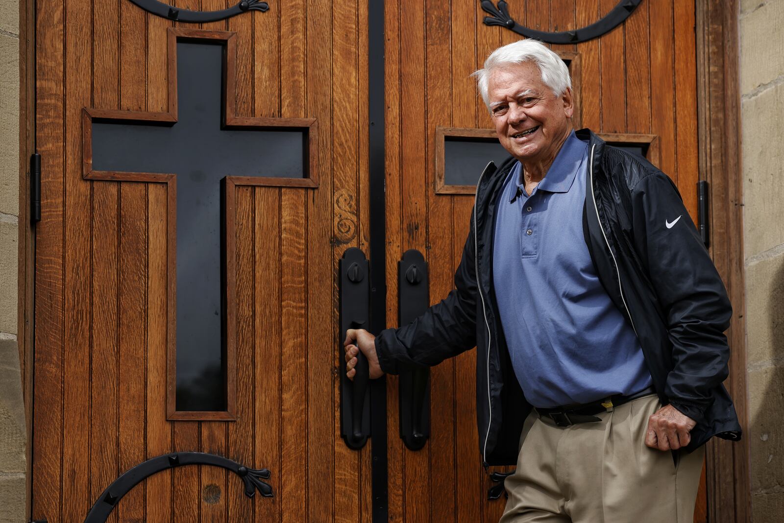 Fr. John Civille stands outside Holy Trinity Church Wednesday, Sept. 22, 2021on Clark Street in Middletown where he has been a pastor for nearly 30 years as part of the Holy Family Parish. NICK GRAHAM / STAFF