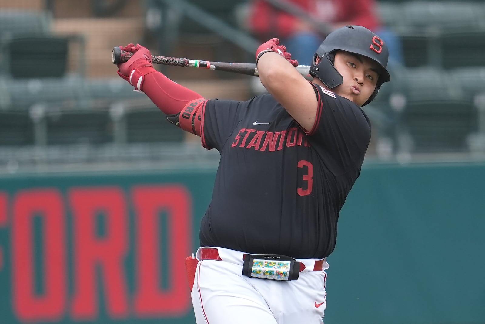 Stanford's Rintaro Sasaki swings in the on-deck circle during the sixth inning of an NCAA college baseball game against Washington in Stanford, Calif., Monday, Feb. 24, 2025. (AP Photo/Jeff Chiu)