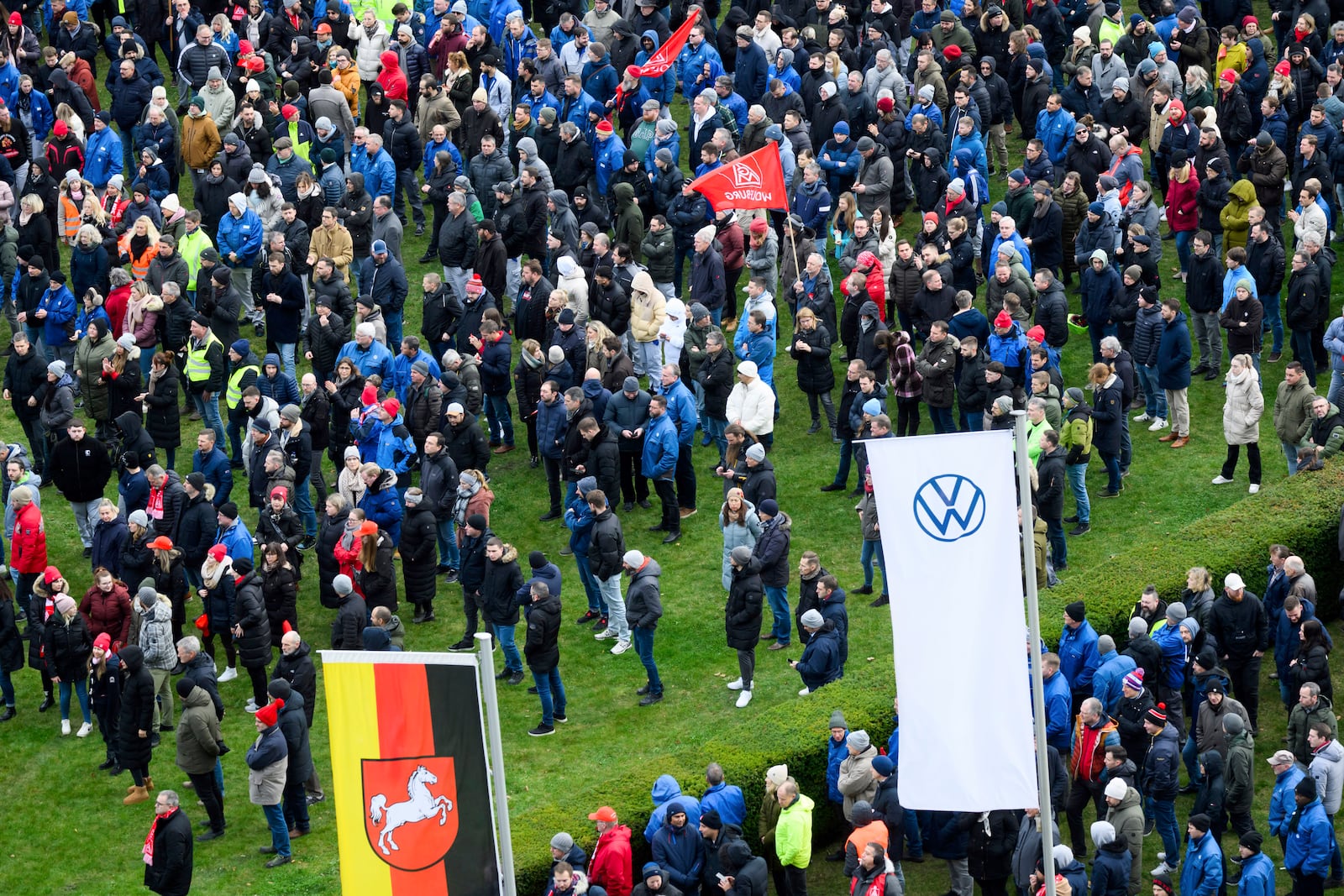 Volkswagen workers attend a rally during at nationwide warning Volkswagen workers' strike, on the grounds of the main Volkswagen plant in Wolfsburg, Germany, Monday, Dec. 2, 2024. (Julian Stratenschulte/Pool Photo via AP)