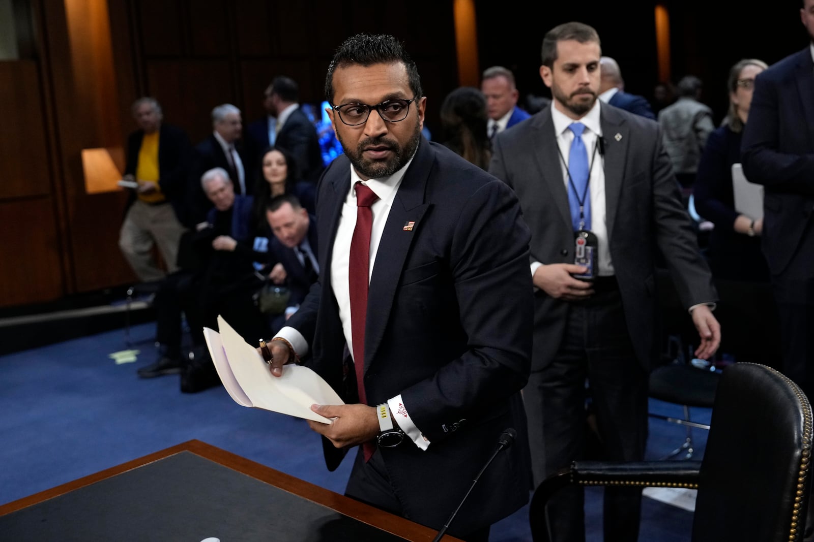 Kash Patel, President Donald Trump's choice to be director of the FBI, departs for a lunch break during his confirmation hearing before the Senate Judiciary Committee at the Capitol in Washington, Thursday, Jan. 30, 2025. (AP Photo/Ben Curtis)