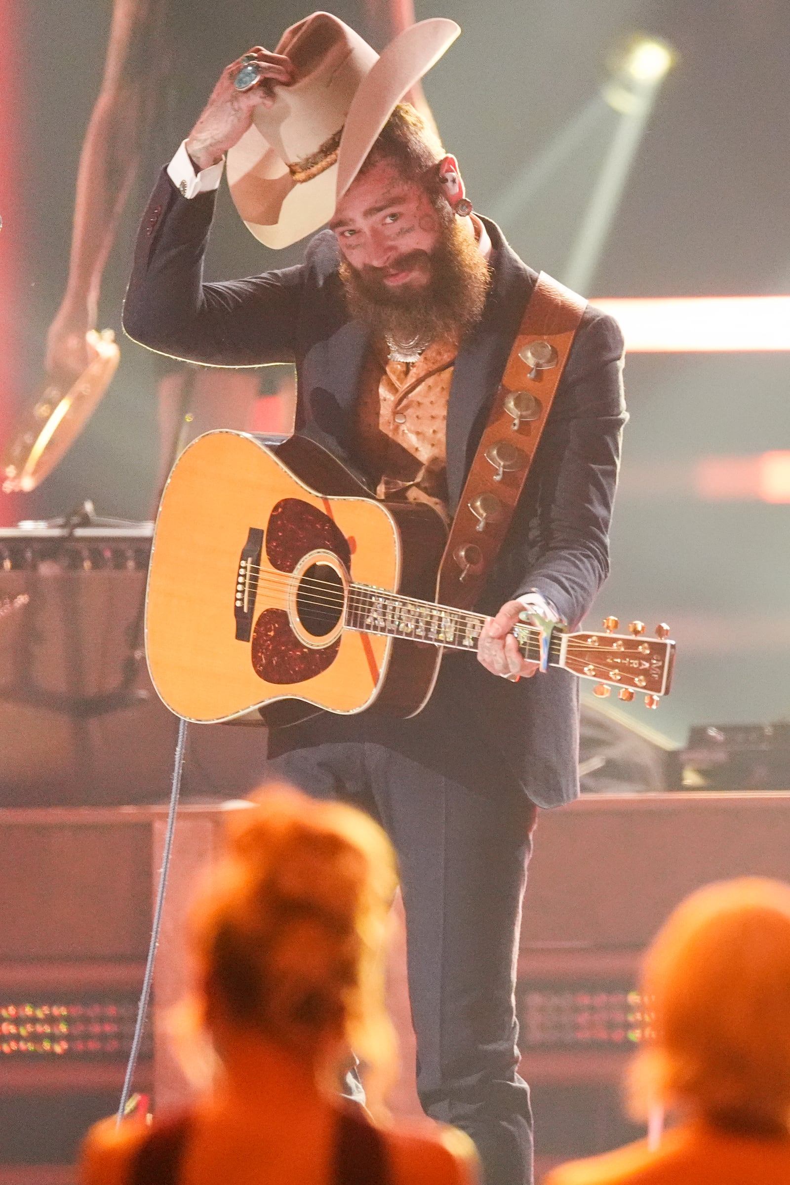 Post Malone performs during the 58th Annual CMA Awards on Wednesday, Nov. 20, 2024, at Bridgestone Arena in Nashville, Tenn. (AP Photo/George Walker IV)