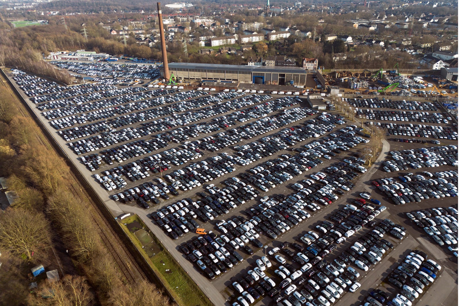 New German cars are stored at a logistic center in Essen, Germany, Monday, Feb. 3, 2025, as US President Trump threatens the European Union (EU) with new tariffs. (AP Photo/Martin Meissner)