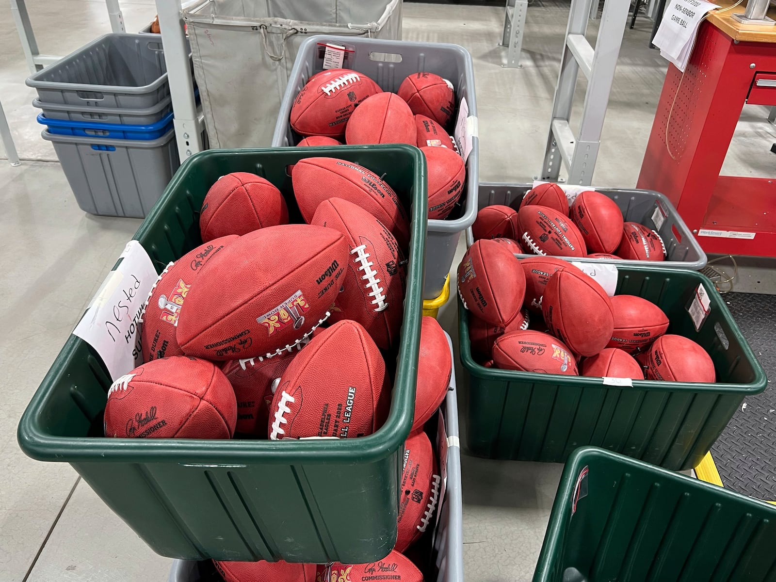 A bin of official balls for the NFL Super Bowl football game wait to be shipped inside the Wilson Sporting Goods football factory, Monday, January 27, 2025, in Ada, Ohio. (AP Photo/Patrick Aftoora-Orsagos)