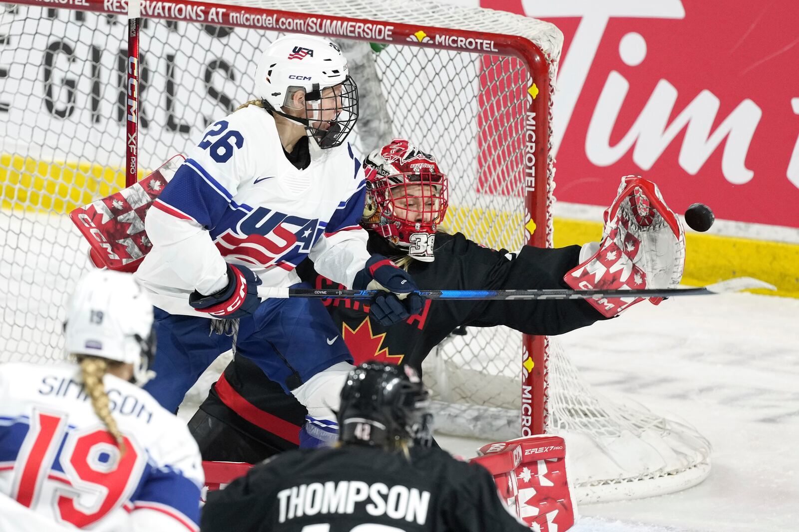 Team Canada goaltender Emerance Maschmeyer, right, makes a save in front of Team USA's Kendall Coyne Schofield during the second period of a Rivalry Series hockey game in Summerside, Prince Edward Island, Canada, Saturday, Feb. 8, 2025. (Darren Calabrese/The Canadian Press via AP)