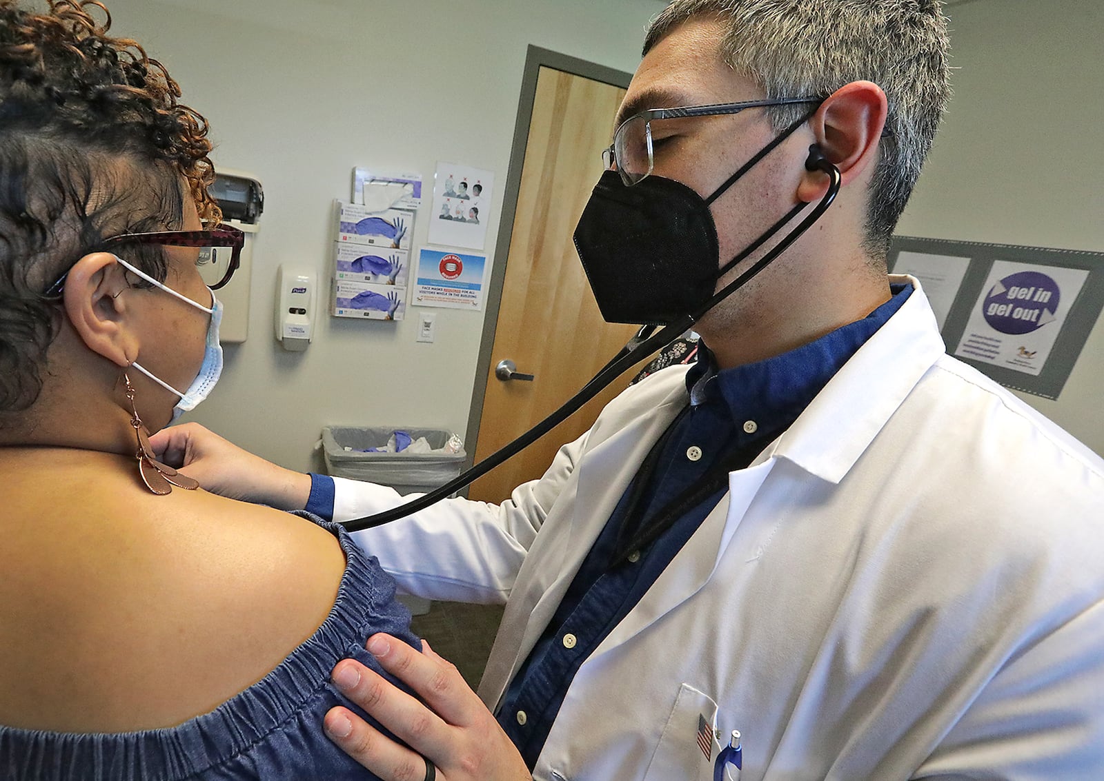 Dr. Andres Barrero Ortiz listens to a patient's heart Wednesday, April 27, 2022 at the Rocking Horse Center in Springfield. BILL LACKEY/STAFF