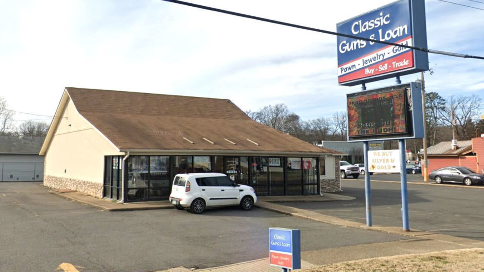 Pictured in a January 2019 Street View image is Classic Guns and Loan, a Hot Springs, Arkansas, pawnshop. Paramedic Lisa Darlene Glaze, 50, is accused of cutting a diamond ring off the finger of a dead patient Oct. 16, 2019, and pawning it there.