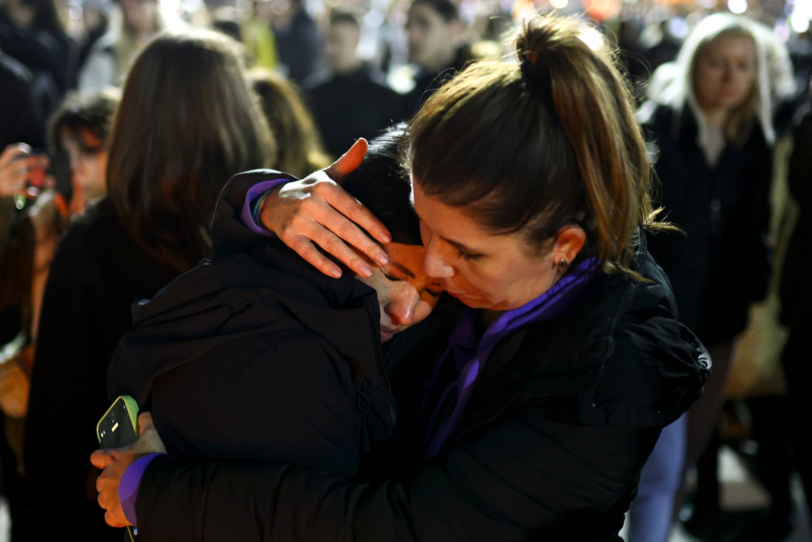 A woman cries at the site of the collapse of a concrete canopy that killed 15 people more than two months ago, during a protest in Novi Sad, Serbia, Friday, Jan. 31, 2025. (AP Photo/Armin Durgut)