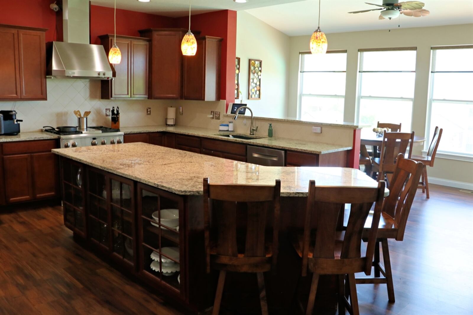 In addition to the spacious island, three walls of cabinetry offer an abundance of storage options in the kitchen.