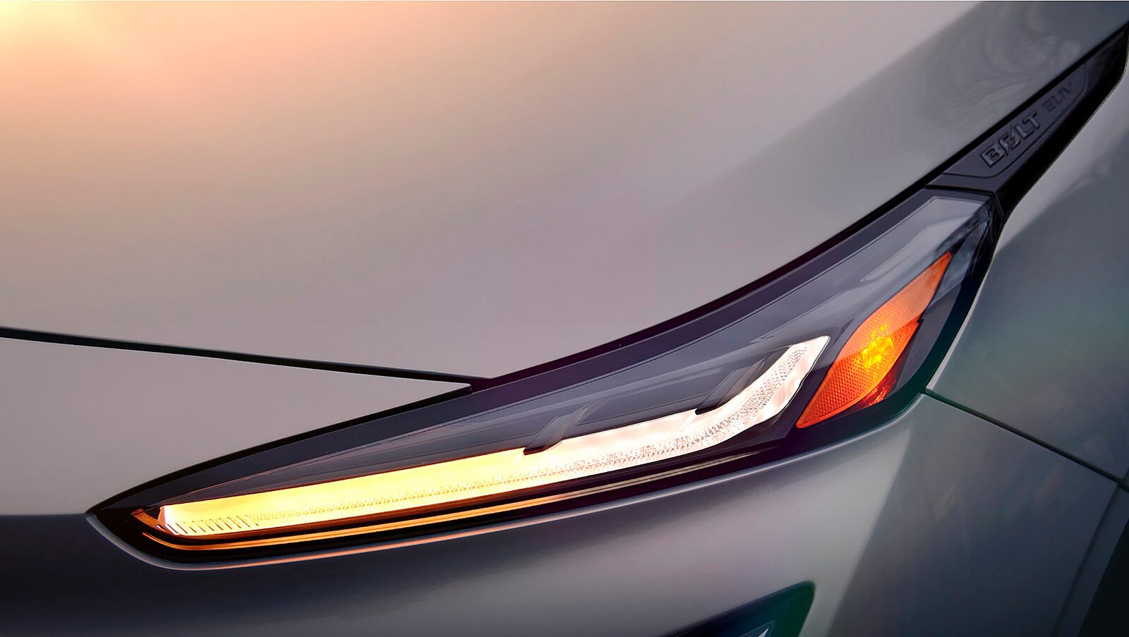 This photo provided by General Motors shows the headlight of the Chevrolet Bolt EUV, an upcoming crossover SUV version of the fully electric Bolt that's scheduled to debut in summer 2021. (Courtesy of General Motors via AP)