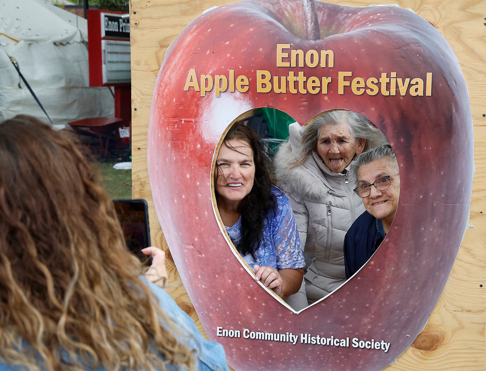 A family poses for a picture Saturday, Oct. 14, 2023 during the Enon Apple Butter Festival. BILL LACKEY/STAFF