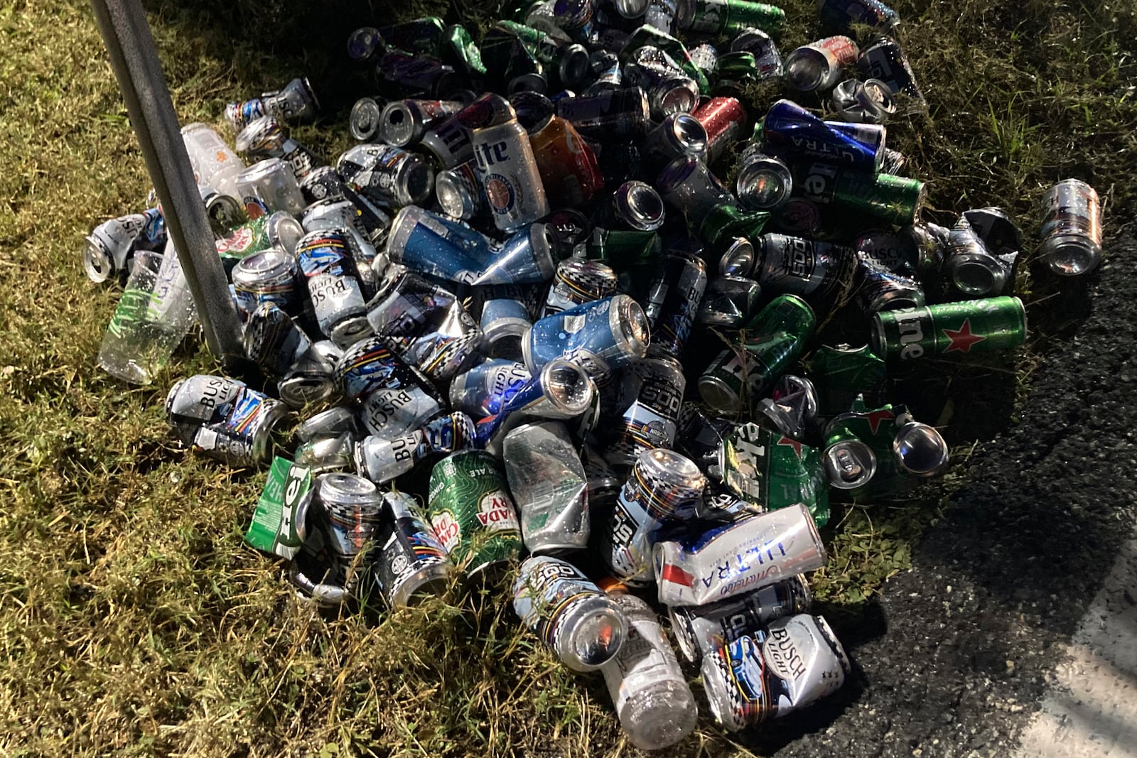 Crushed beer cans litter the Daytona International Speedway, Wednesday, Feb. 12 , 2025 in Daytona Beach, Fla. (AP Photo/Dan Gelston)