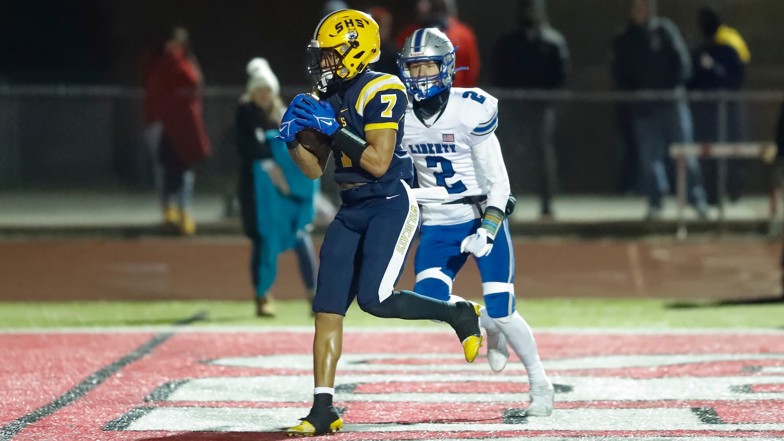 Springfield High School's Anthony Brown catches a touchdown pass during their game against Olentangy Liberty on Friday night at London's Bowlus Field. The Wildcats won 35-7 to win their fourth straight regional championship. CONTRIBUTED PHOTO BY MICHAEL COOPER