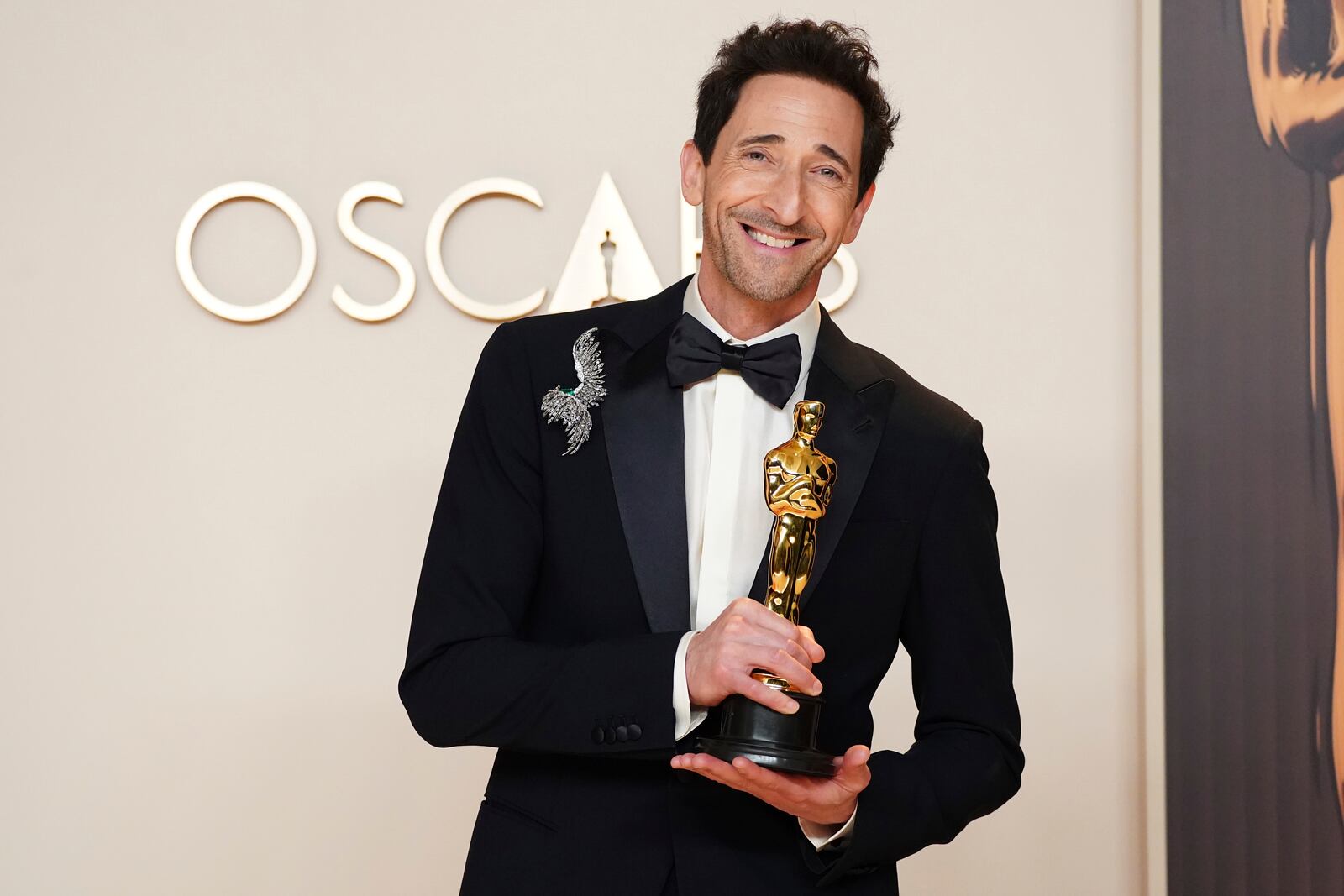 Adrien Brody, winner of the award for best performance by an actor in a leading role for "The Brutalist," poses in the press room at the Oscars on Sunday, March 2, 2025, at the Dolby Theatre in Los Angeles. (Photo by Jordan Strauss/Invision/AP)