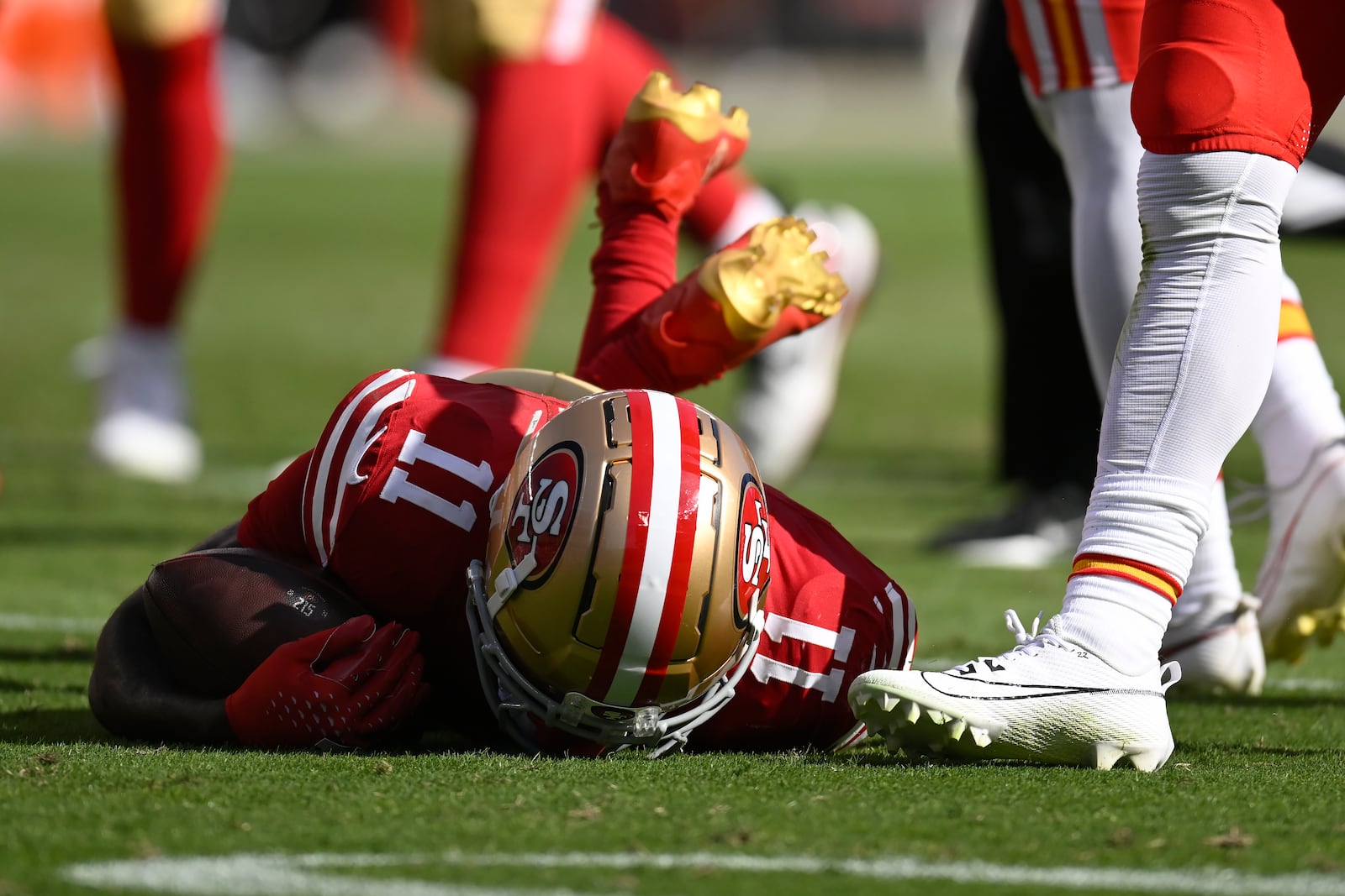 San Francisco 49ers wide receiver Brandon Aiyuk (11) remains on the field after being hit during the first half of an NFL football game against the Kansas City Chiefs in Santa Clara, Calif., Sunday, Oct. 20, 2024. (AP Photo/Eakin Howard)