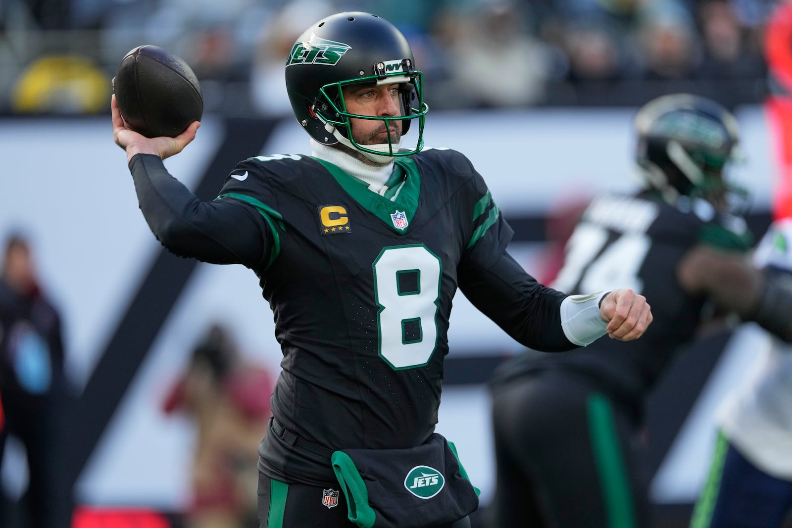 New York Jets quarterback Aaron Rodgers (8) passes against the Seattle Seahawks during the first quarter of an NFL football game, Sunday, Dec. 1, 2024, in East Rutherford, N.J. (AP Photo/Seth Wenig)