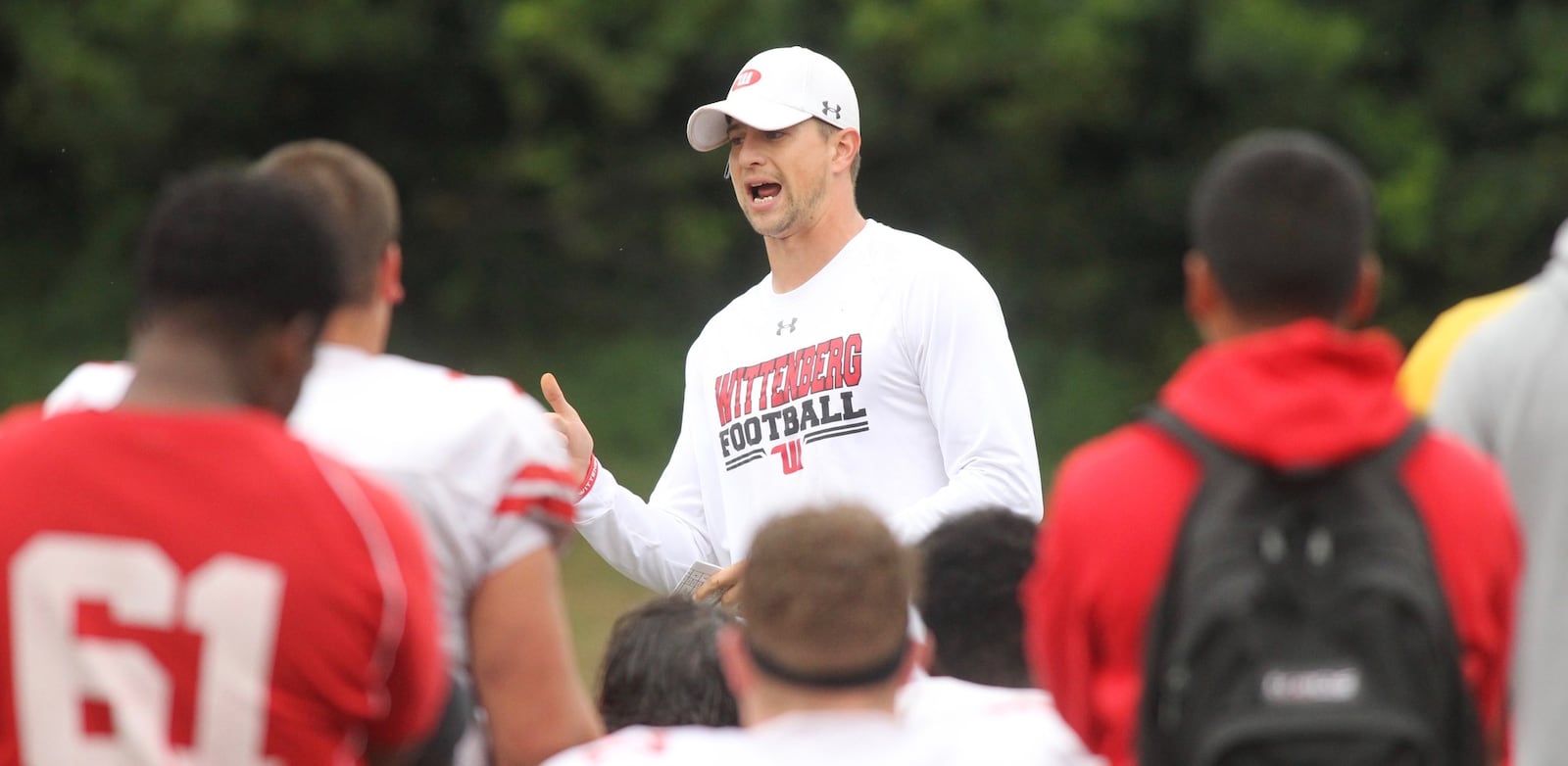 Wittenberg’s Reed Florence talks to the players at practice on Monday, Aug. 29, 2017, in Springfield. David Jablonski/Staff