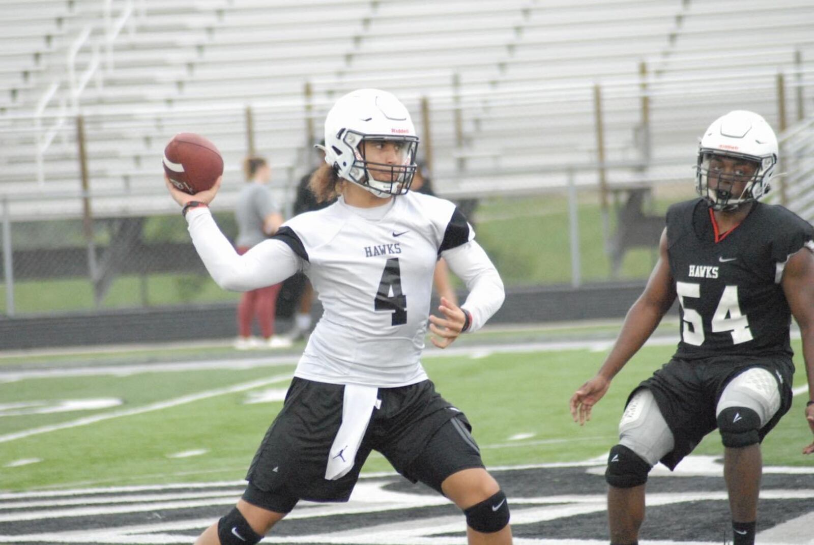 Lakota East quarterback JT Kitna gets ready to throw a pass during a recent practice. Chris Vogt/CONTRIBUTED