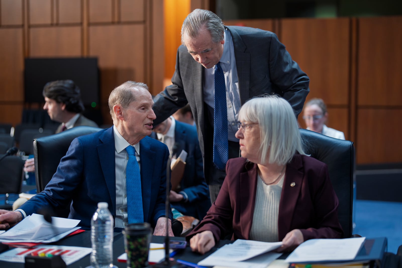 Senate Budget Committee members, from left, Sen. Ron Wyden, D-Ore., Sen. Jeff Merkley, D-Ore., the ranking member, and Sen. Patty Murray, D-Wash., work on the markup of the Fiscal Year 2025 Budget Resolution, on Capitol Hill in Washington, Wednesday, Feb. 12, 2025. (AP Photo/J. Scott Applewhite)