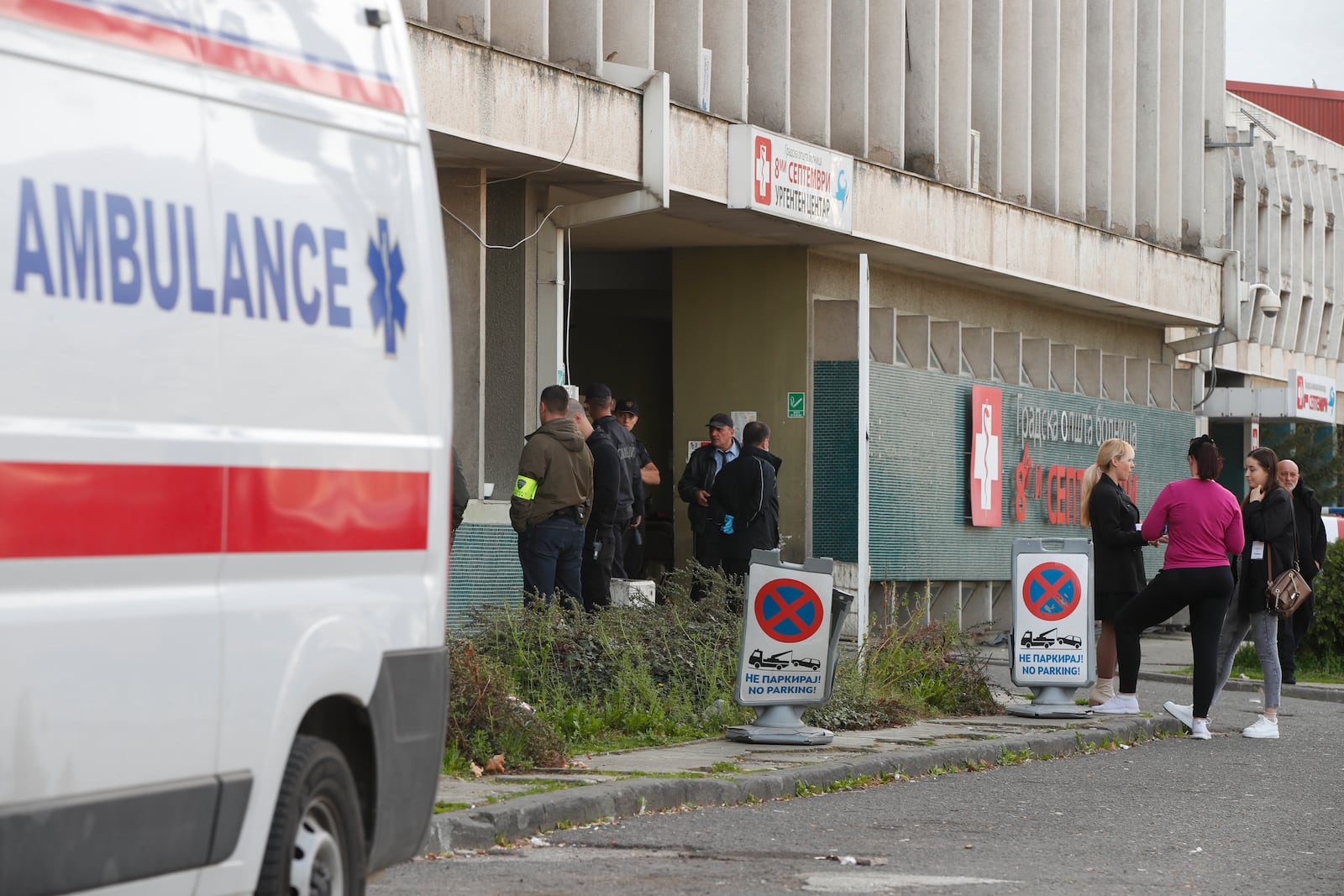 People wait in front of the hospital in the town of Kocani, North Macedonia, Sunday, March 16, 2025, after a massive fire in a nightclub. (AP Photo/Boris Grdanoski)