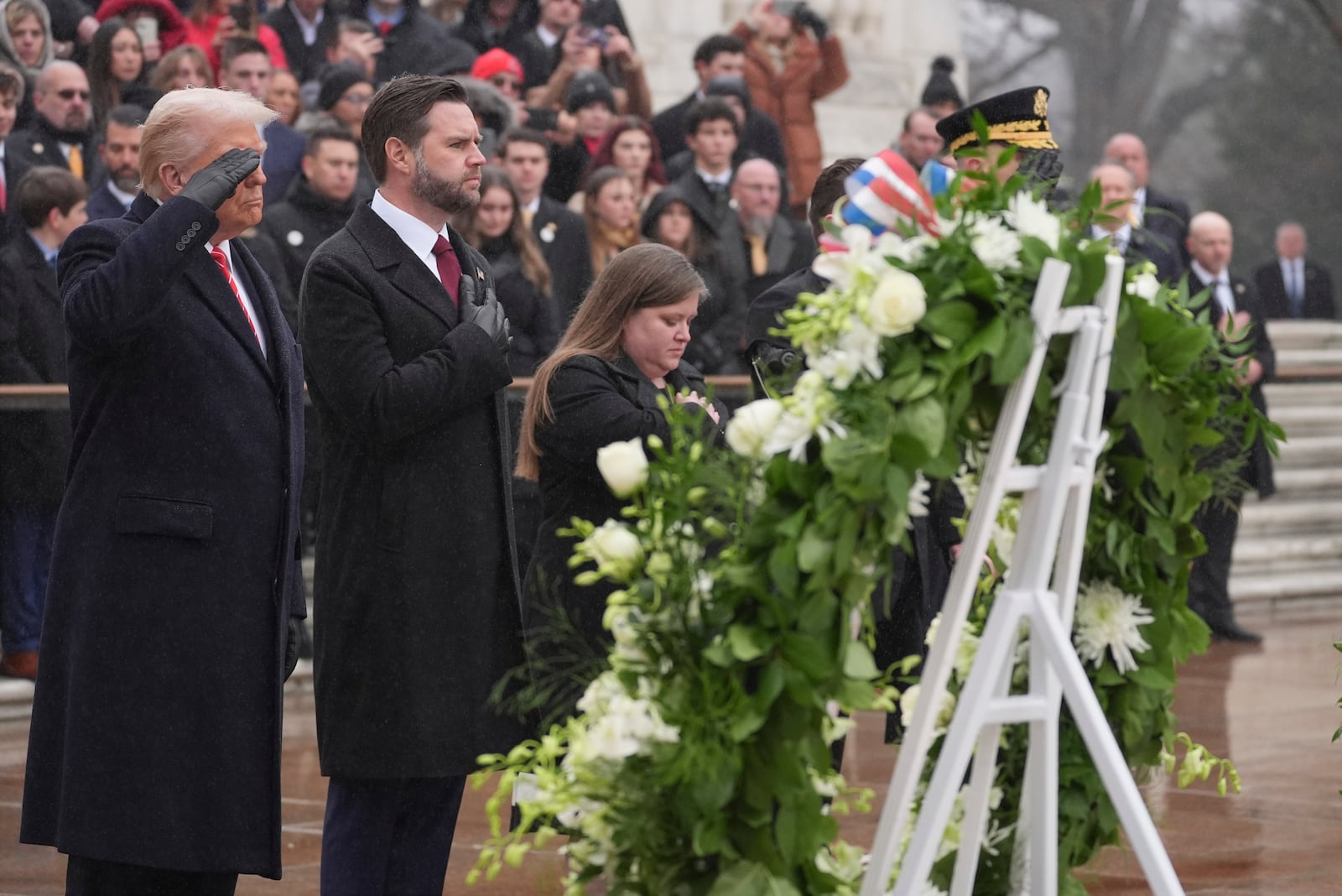 President-elect Donald Trump and Vice President-elect JD Vance participate in a wreath laying ceremony at Arlington National Cemetery, Sunday, Jan. 19, 2025, in Arlington, Va. (AP Photo/Evan Vucci)