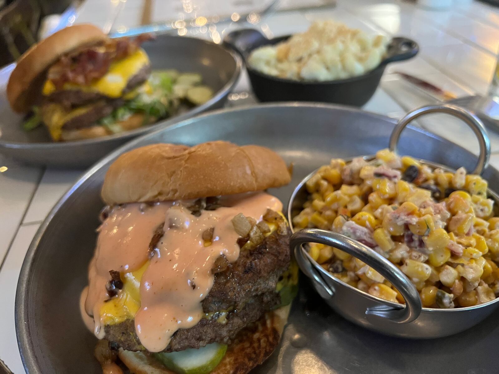 Bourbon's Craft Kitchen and Bar In 'N Out Burger with a side of elote corn