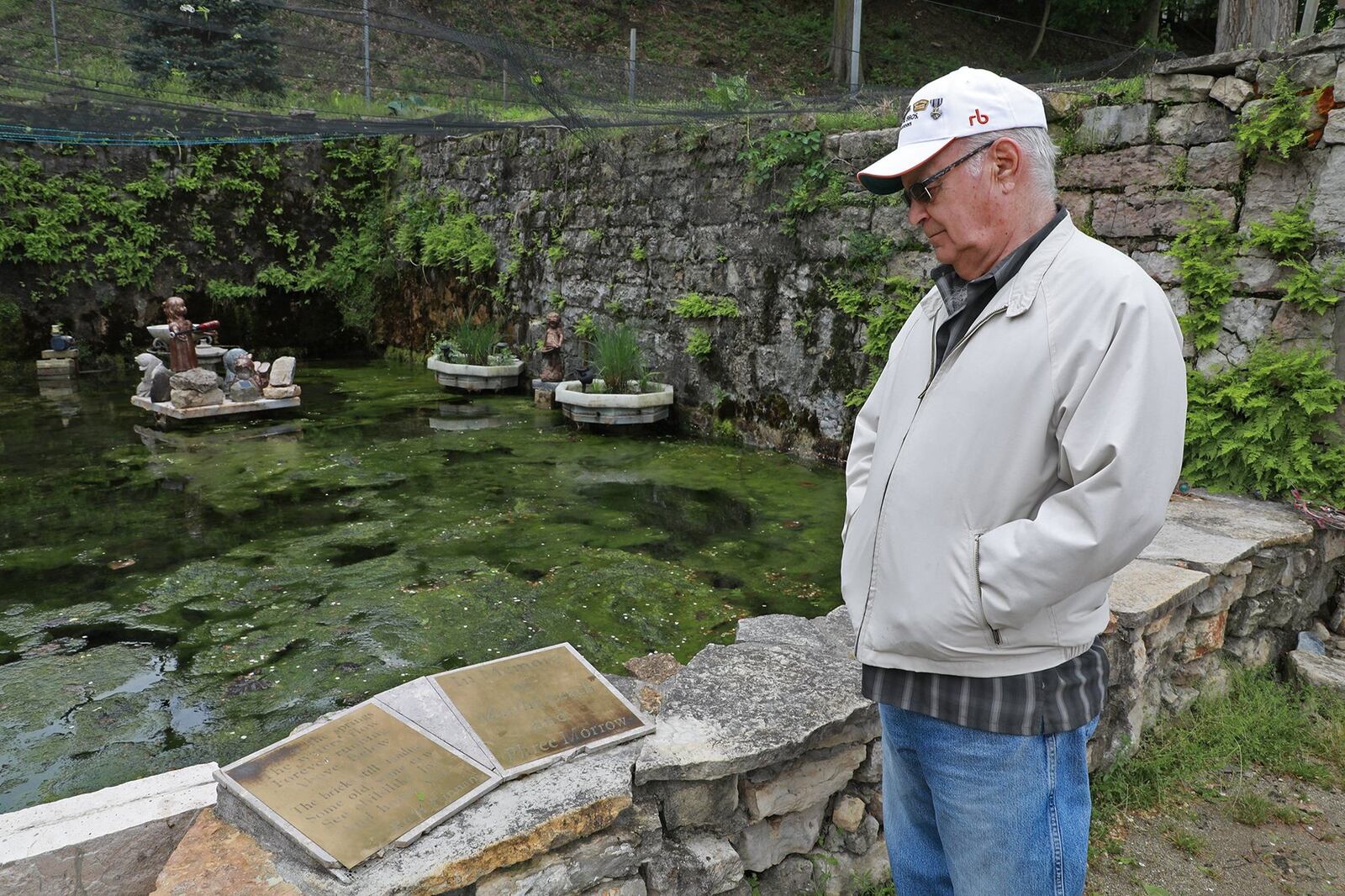 Vernon Donnelly looks over the Children’s Memorial, which was vandalized recently. BILL LACKEY/STAFF