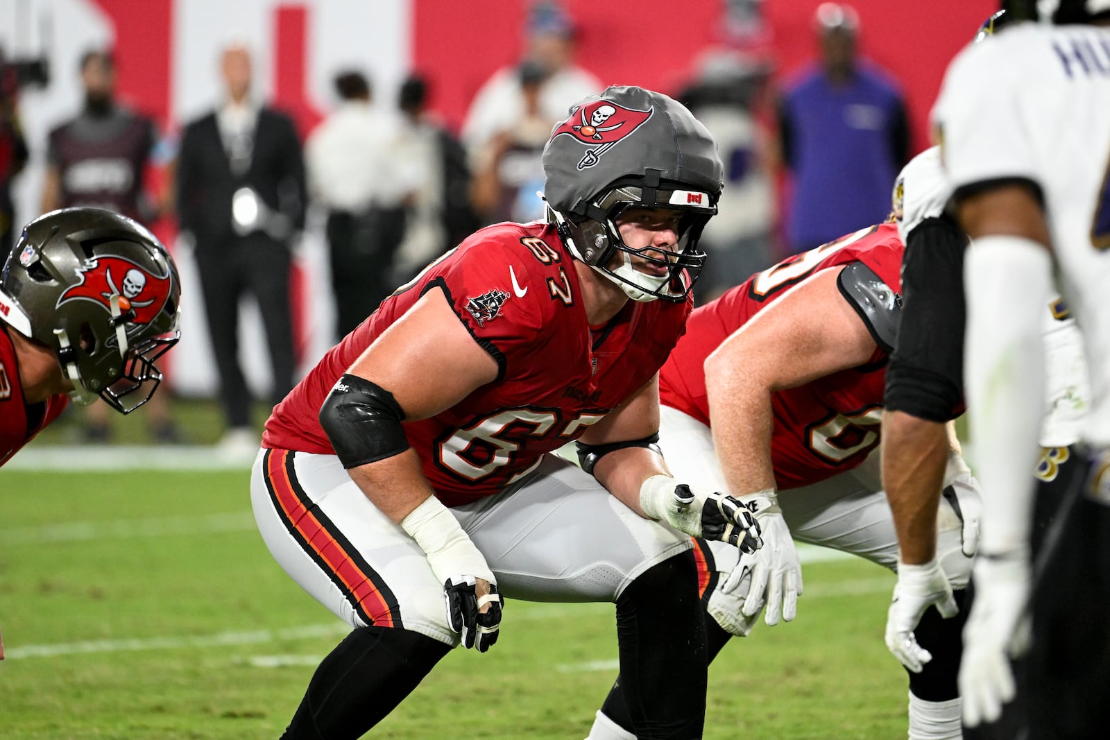 Tampa Bay Buccaneers offensive tackle Luke Goedeke (67) wears a protective cap during the first half of an NFL football game against Baltimore Ravens, Monday, Oct. 21, 2024, in Tampa, Fla. (AP Photo/Jason Behnken)