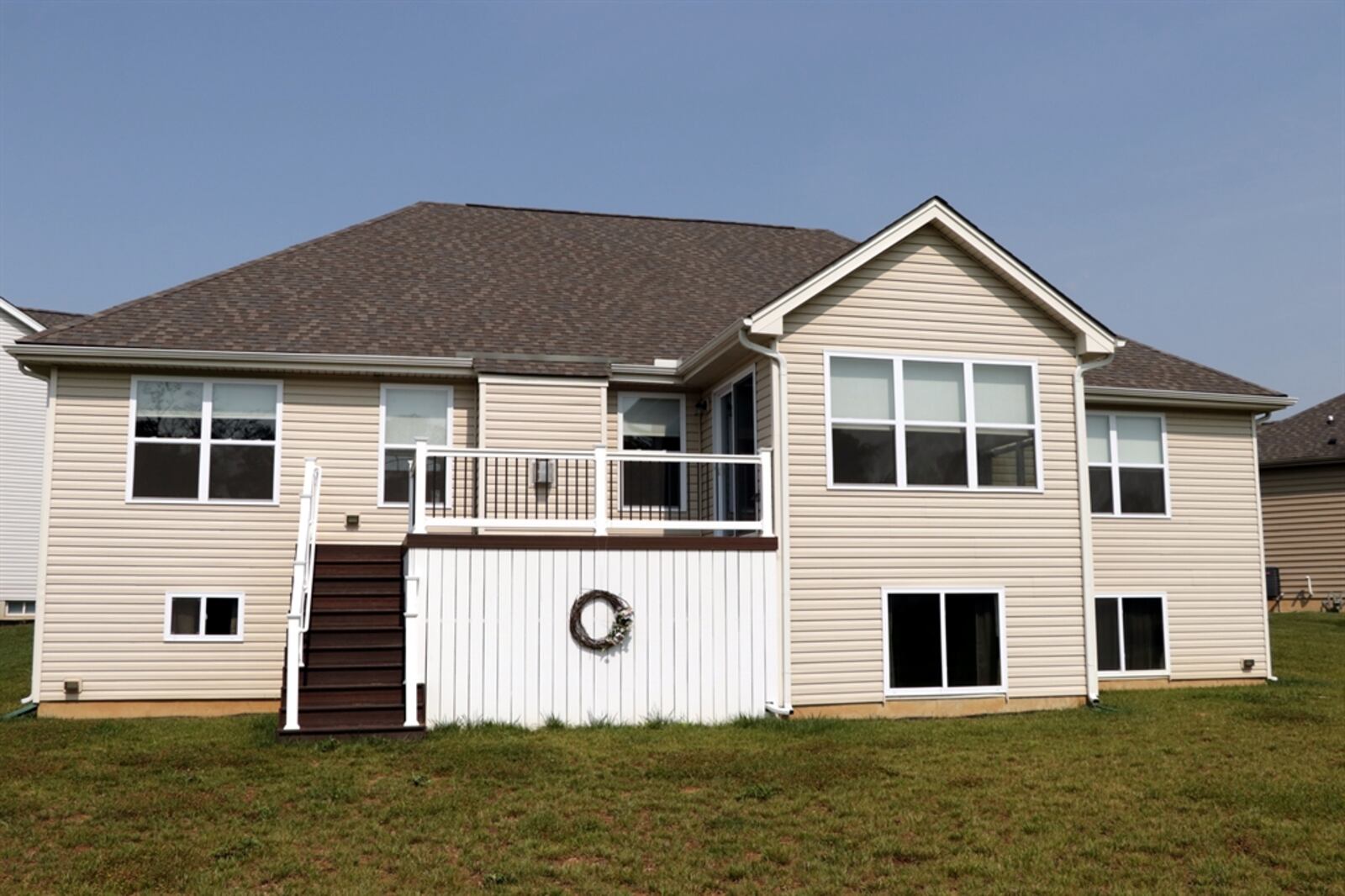 Sliding patio doors open out to the composite balcony deck with built-in storage underneath. The split floor plan ranch is on a full unfinished basement which has daylight windows and is plumbed for a bath. Kathy Tyler/CONTRIBUTED