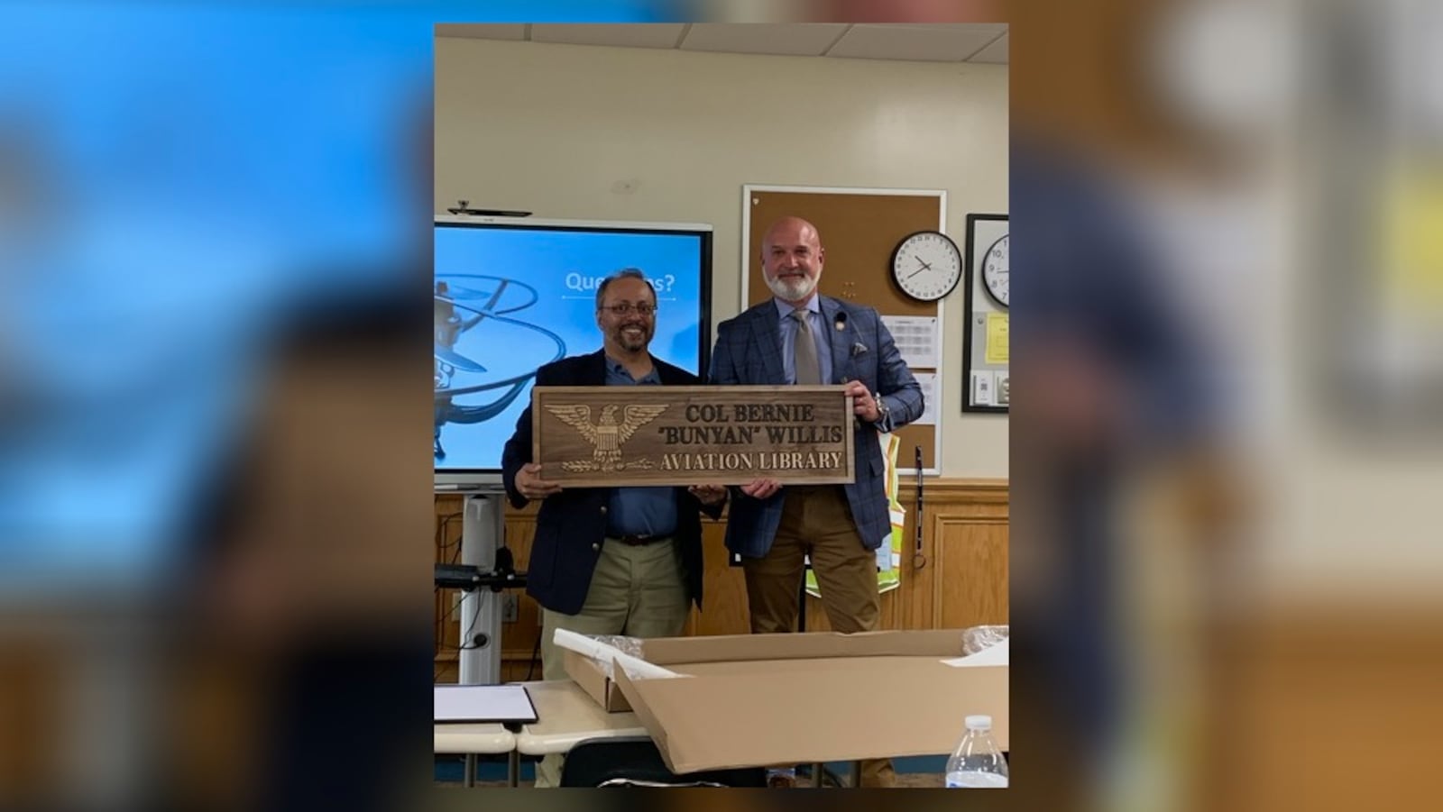 Shadh Molla, professor of the Emmanuel Christian Academy Aerospace Institute, dedicated the school's aviation library to Rep. Bernie Willis during an Ohio drone program meeting that was held Wednesday, May 8. Willis helped spearhead the program into Ohio. Brooke Spurlock/Staff