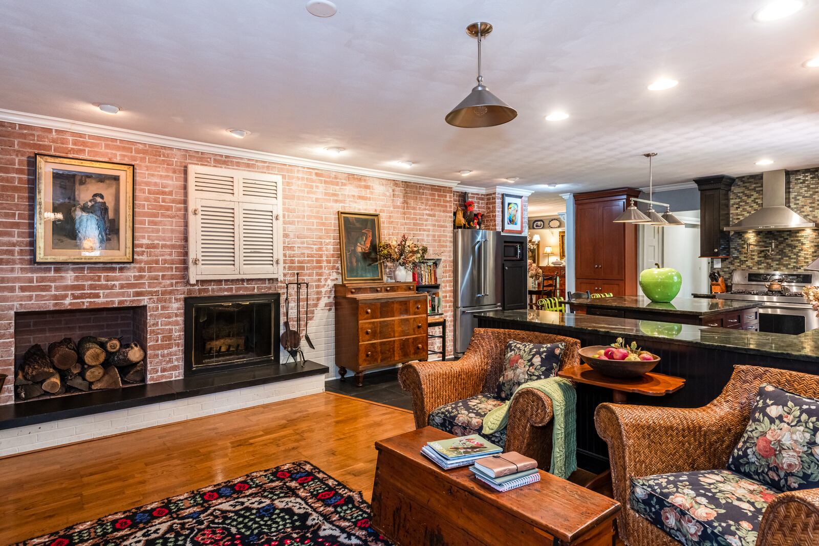 The home features two wood-burning fireplaces, one of which is in the kitchen and family room.  Contributed