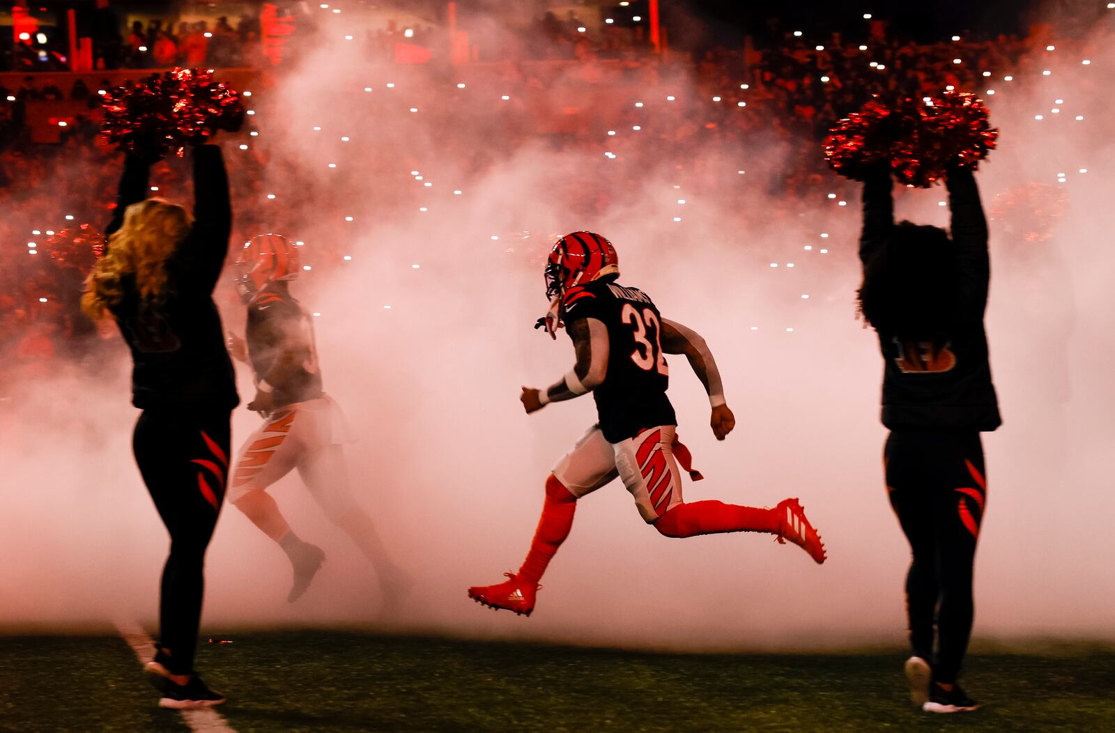 Bengals running back Treyveon Williams runs onto the field before Cincinnati's AFC Wild Card playoff game against the Baltimore Ravens Sunday, Jan. 15, 2023 at Paycor Stadium in Cincinnati. The Bengals won 24-17. NICK GRAHAM/STAFF