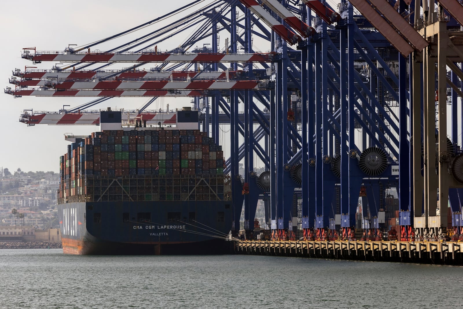 A container ship is docked in the Port of Los Angeles, Monday, March 10, 2025, in San Pedro, Calif. (AP Photo/Etienne Laurent)