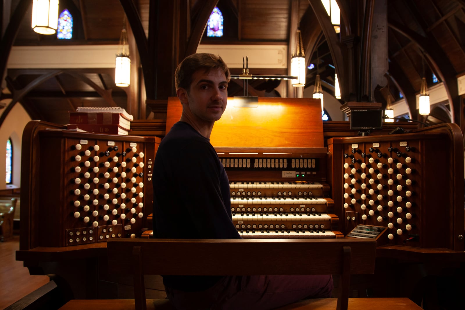 Colin MacKnight, Director of Music at Trinity Episcopal Cathedral in Little Rock, Ark., rehearses on Tuesday, Jan. 21, 2025, for his upcoming lunch-time concert series. This year-long weekly series of free concerts features the works of Johann Sebastian Bach. (AP Photo/Katie Adkins)