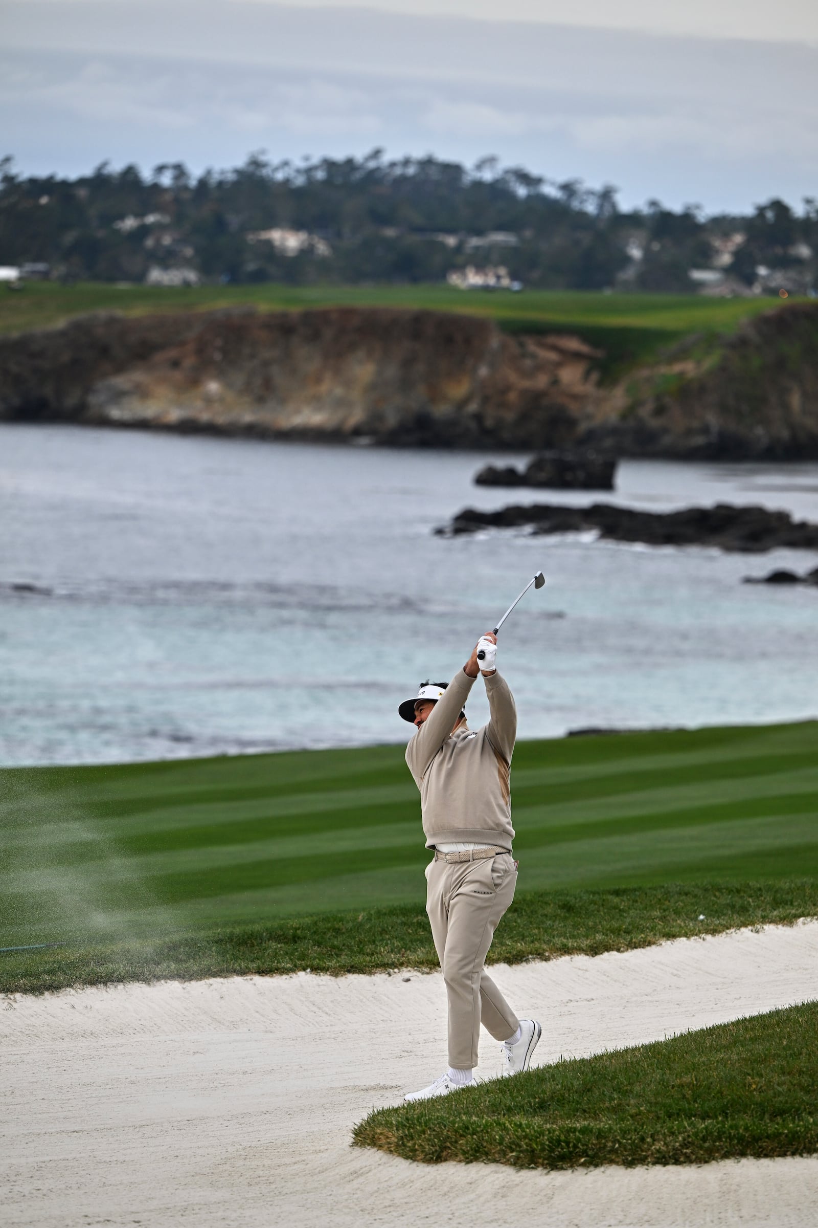 Jason Day of Australia hits from a fairway bunker on the 10th hole at Pebble Beach Golf Links during the second round of the AT&T Pebble Beach Pro-Am golf tournament, Friday, Jan. 31, 2025, in Pebble Beach, Calif. (AP Photo/Nic Coury)