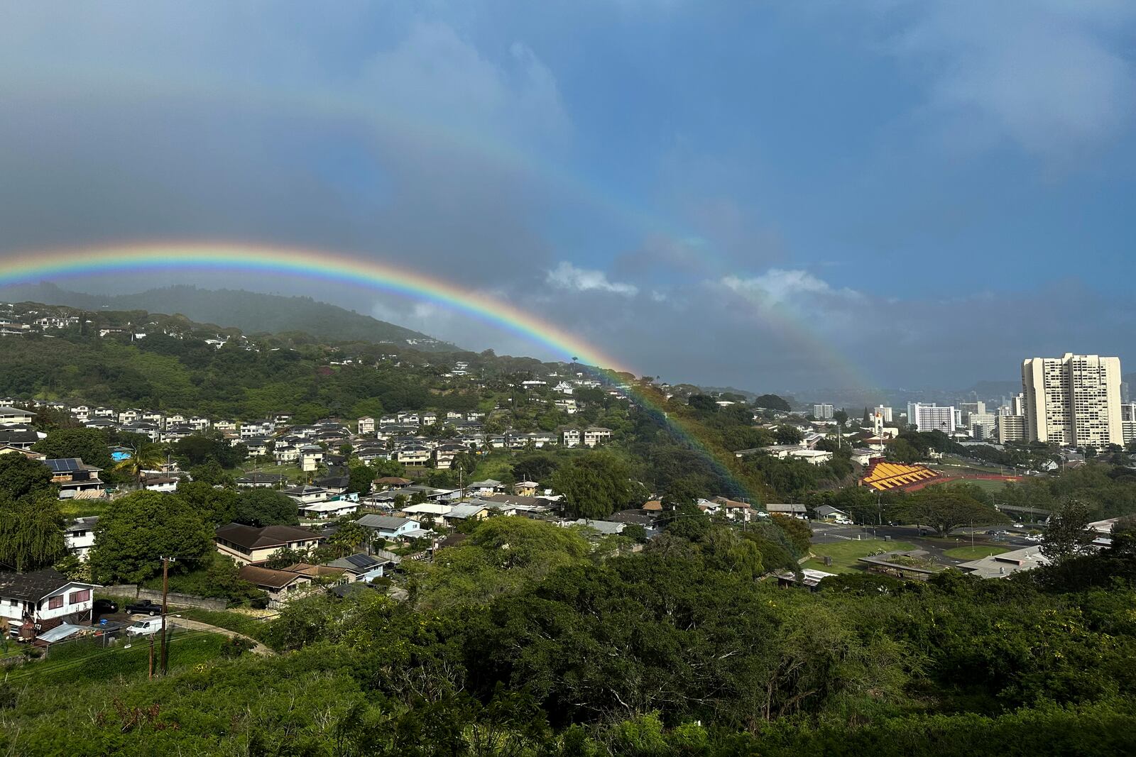 Two rainbows are seen in the sky on April 24, 2024, in Honolulu. (AP Photo/Audrey McAvoy)